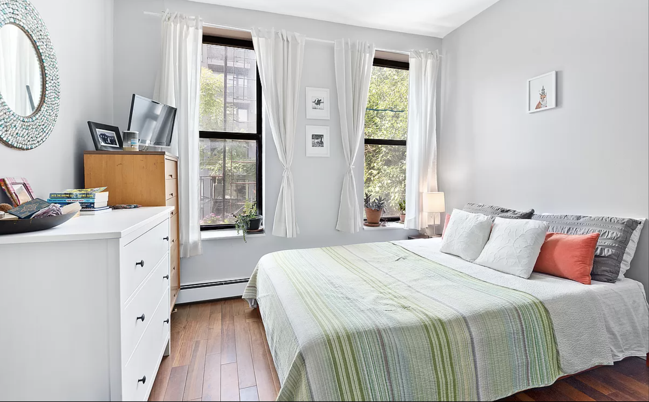 706 Sackett Street, Unit 2 Brooklyn, NY 11217 - Photo 4 of 7 a bedroom with a bed and a dresser