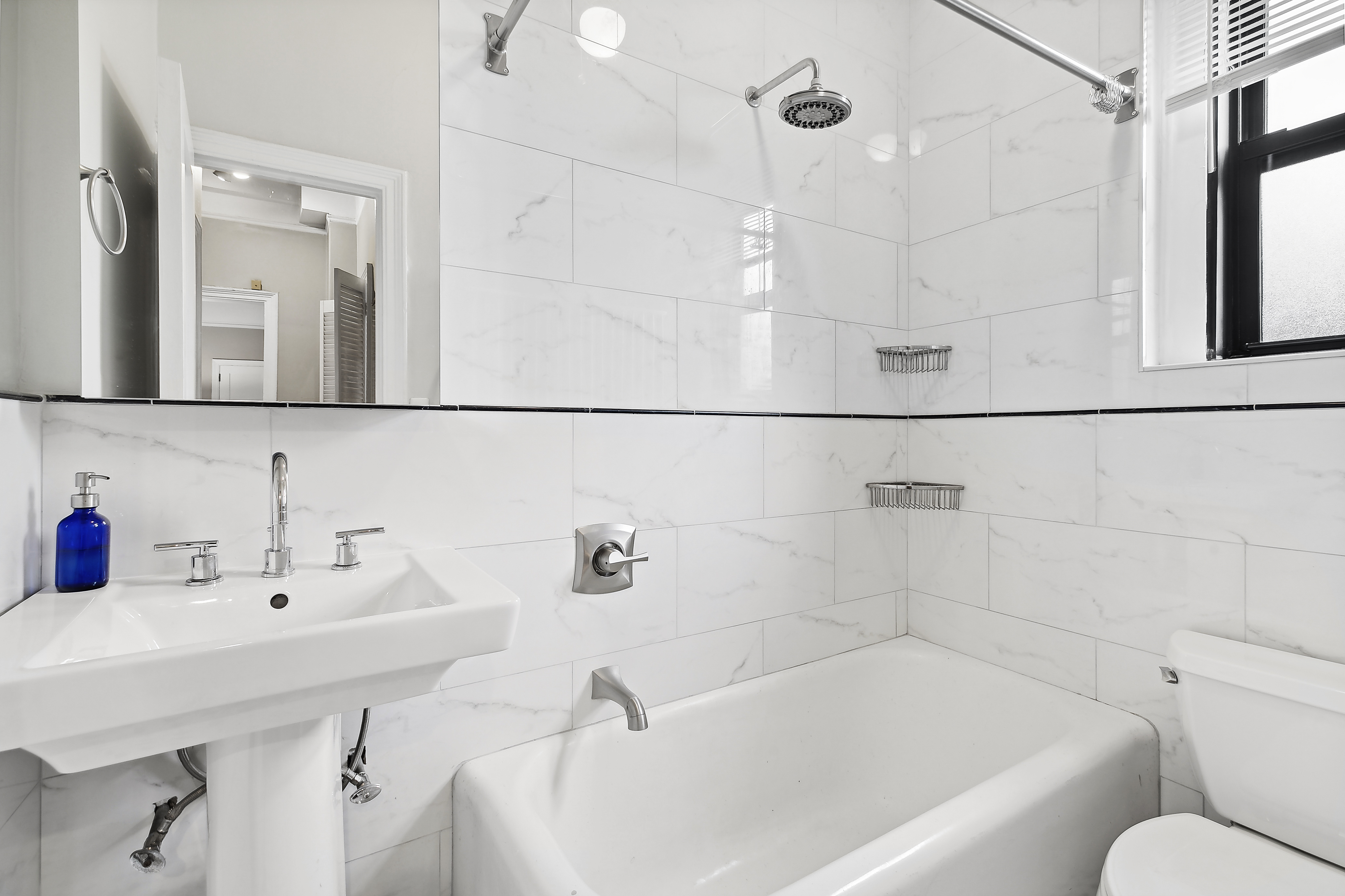 321 East 54th Street Manhattan, NY 10022 - Photo 4 of 5 a bathroom with a sink and a bathtub