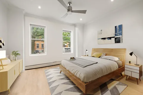 a bedroom with bed and window