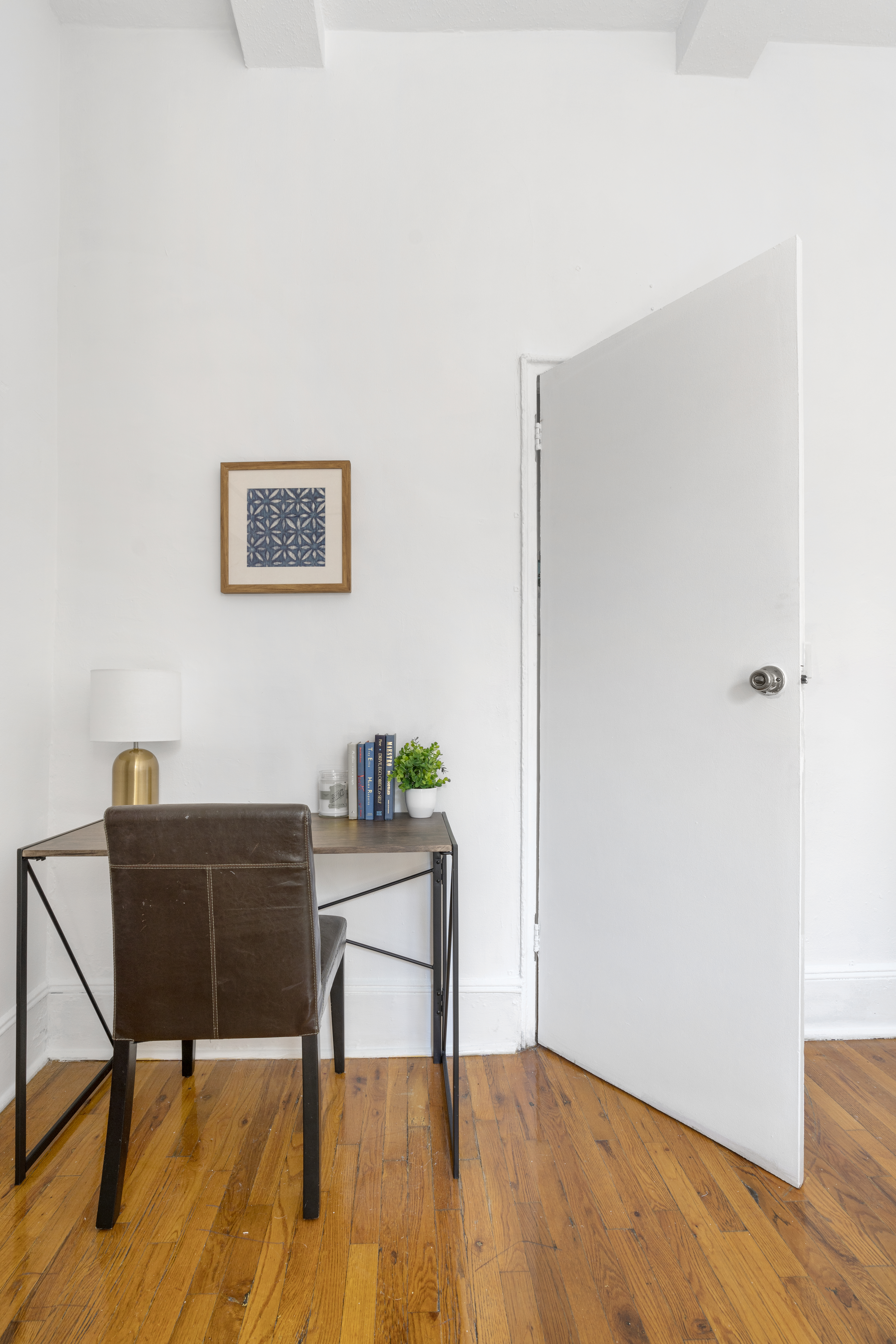 458 West 20th Street, Unit 3D Manhattan, NY 10011 - Photo 6 of 9 a workspace room with furniture and wooden floor