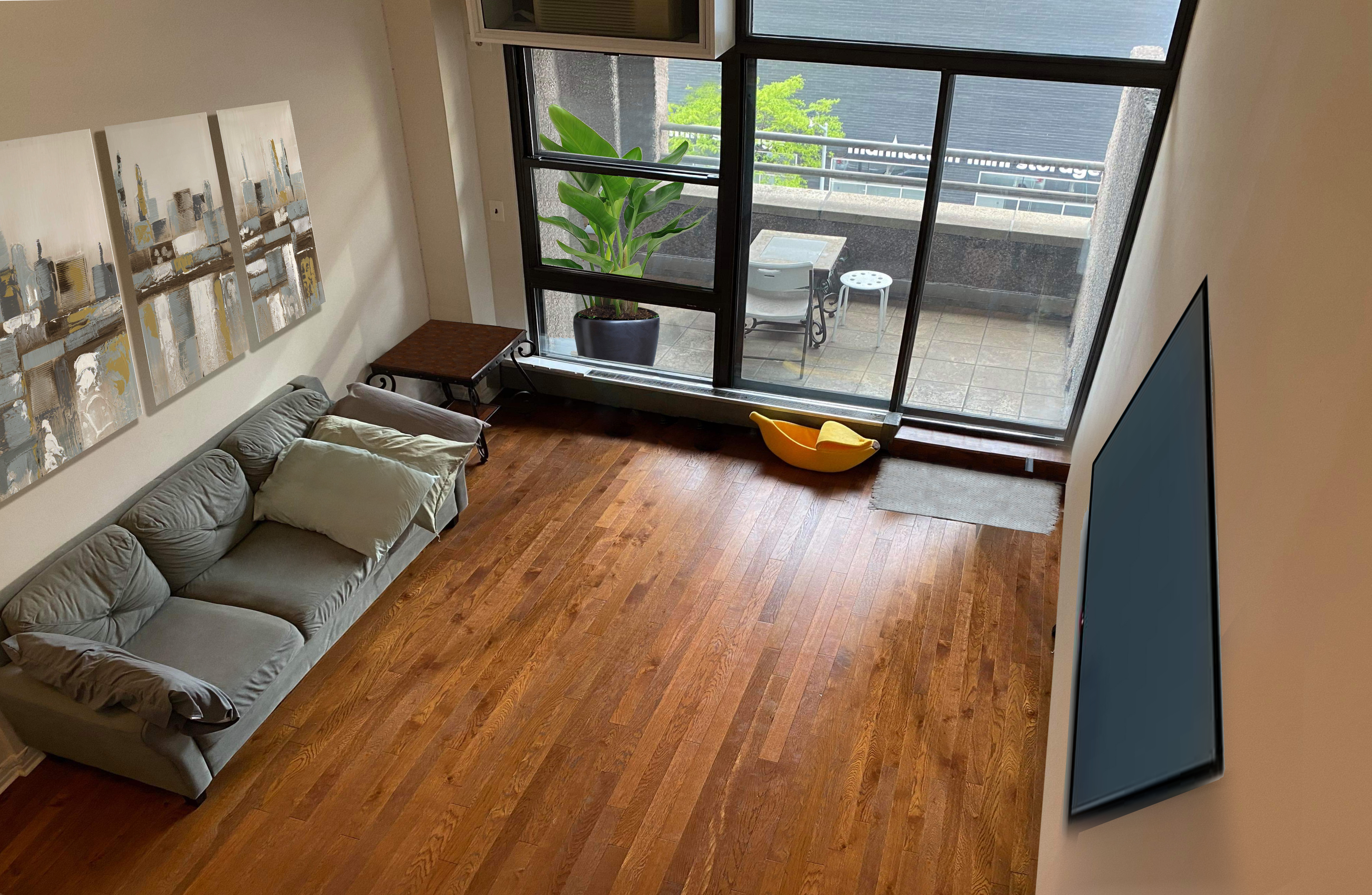 350 East 62nd Street, Unit 4D Manhattan, NY 10065 - Photo 1 of 3 a living room with furniture and a wooden floor