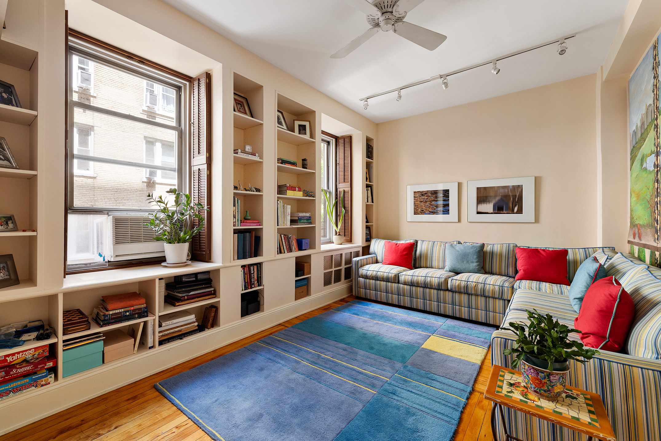 151 West 86th Street, Unit 4D Manhattan, NY 10024 - Photo 6 of 15 a living room with furniture and wooden floor