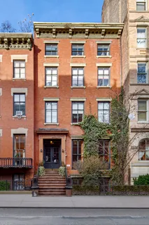 a front view of a building with garden
