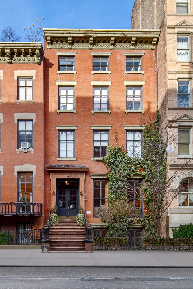 a front view of a building with garden