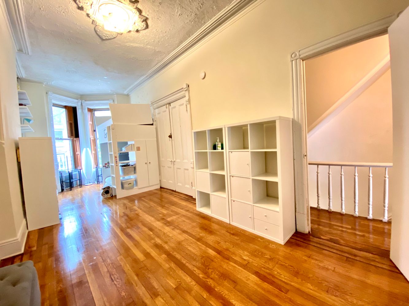 390 5th Street, Unit 1 Brooklyn, NY 11215 - Photo 4 of 15 a view of an empty room with wooden floor and window