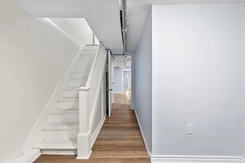 a view of a hallway with staircase