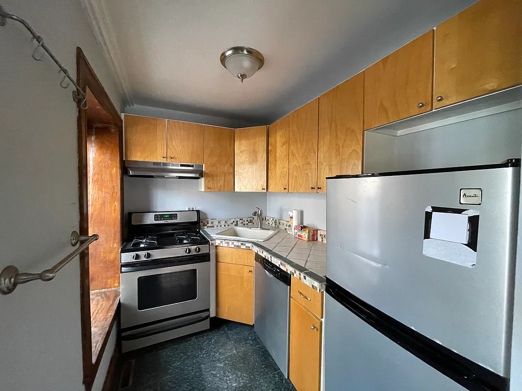 343 Carlton Avenue, Unit 1A Brooklyn, NY 11238 - Photo 3 of 6 a kitchen with stainless steel appliances a refrigerator sink and stove