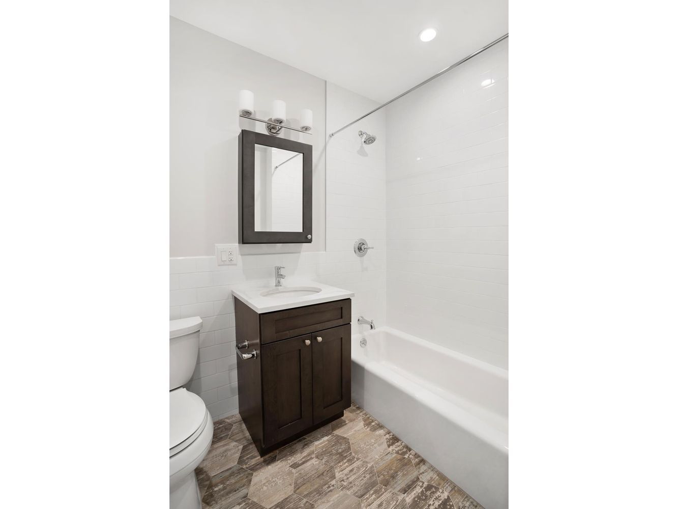 136 Union Street, Unit 2 Brooklyn, NY 11231 - Photo 4 of 9 a bathroom with a sink a toilet and shower