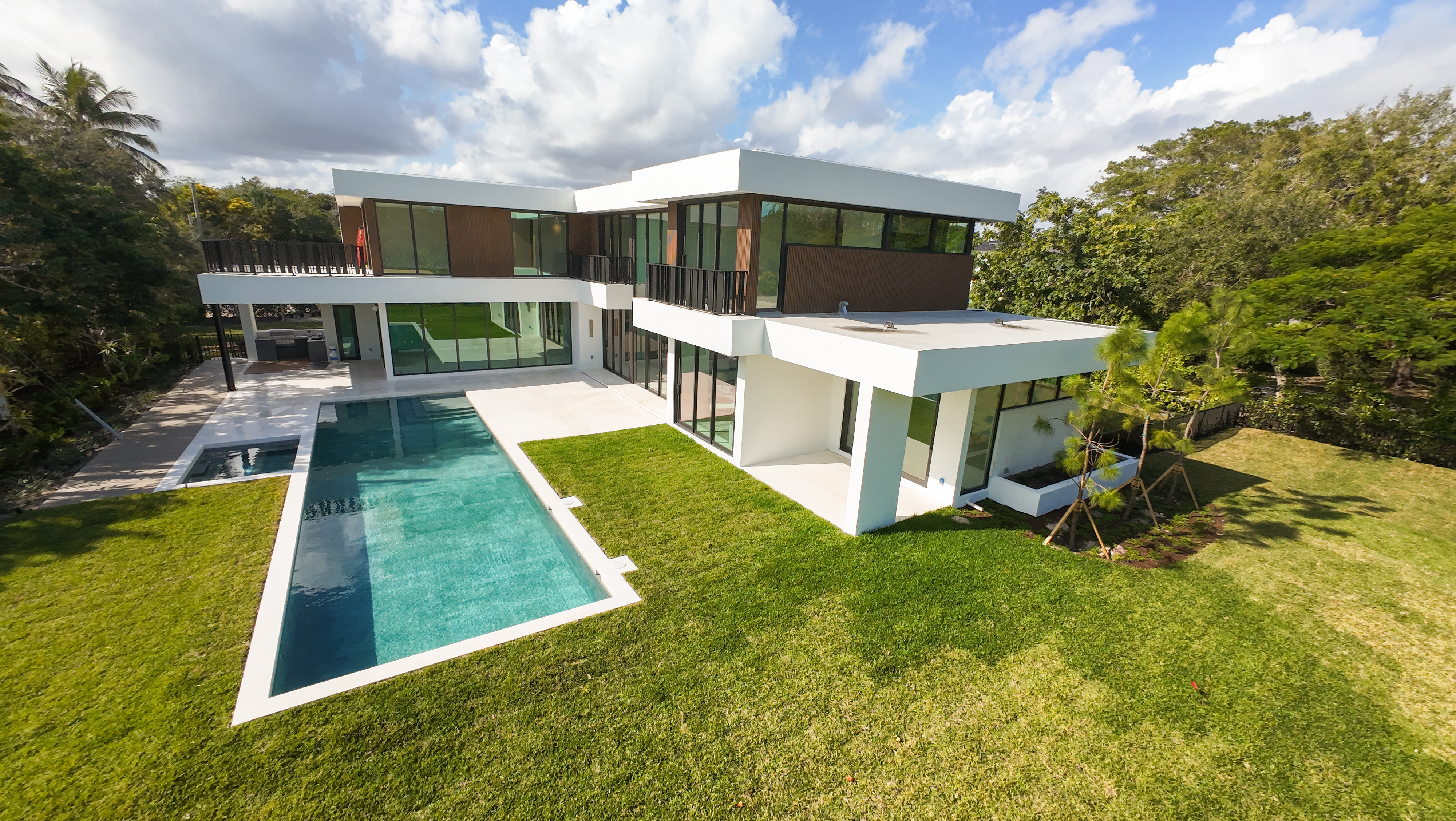 6920 Southwest 124th Street Pinecrest, FL 33156 - Photo 38 of 48 a view of a patio with table and chairs under an umbrella
