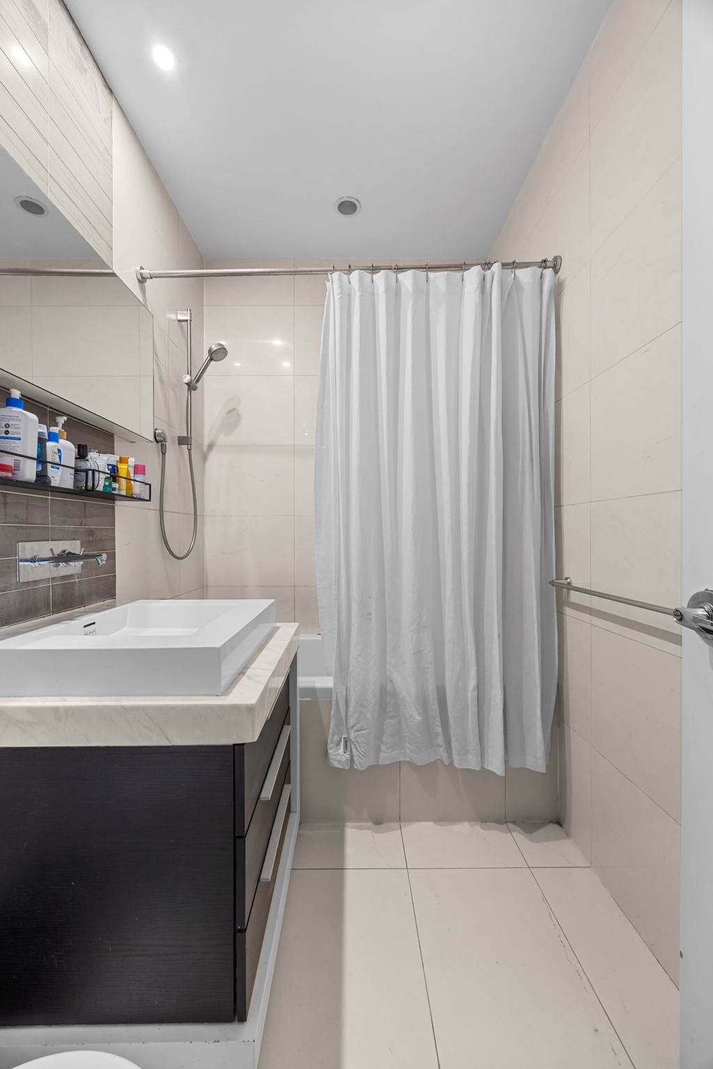 161 North 4th Street, Unit 1C Brooklyn, NY 11211 - Photo 6 of 10 a bathroom with a sink and a mirror