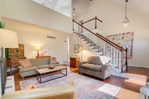 a living room with furniture fireplace and a flat screen tv