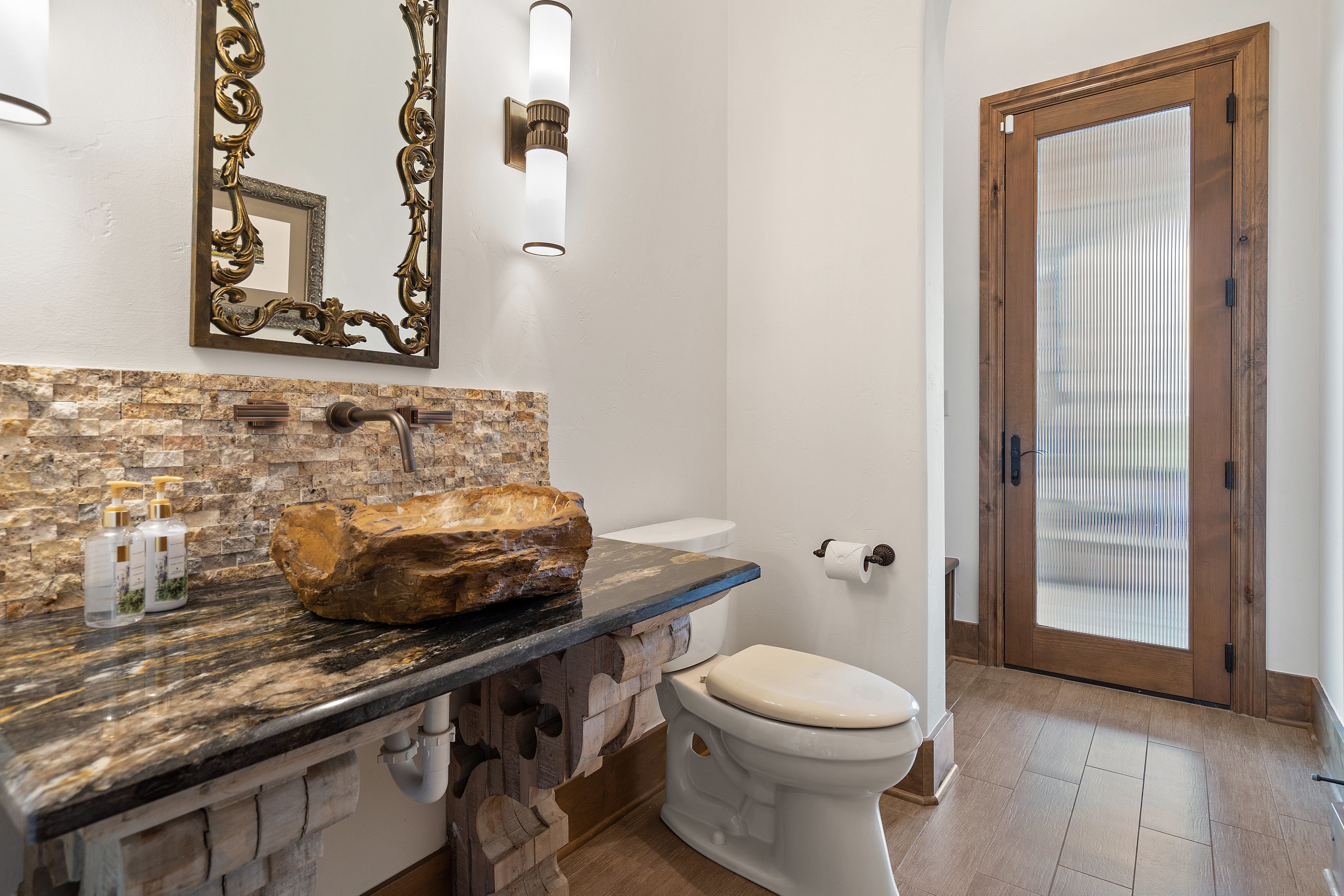 808 Rivercliff Drive Spicewood, TX 78669 - Photo 55 of 71 a bathroom with a toilet and a sink