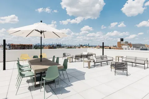 a view of a terrace with furniture and stove