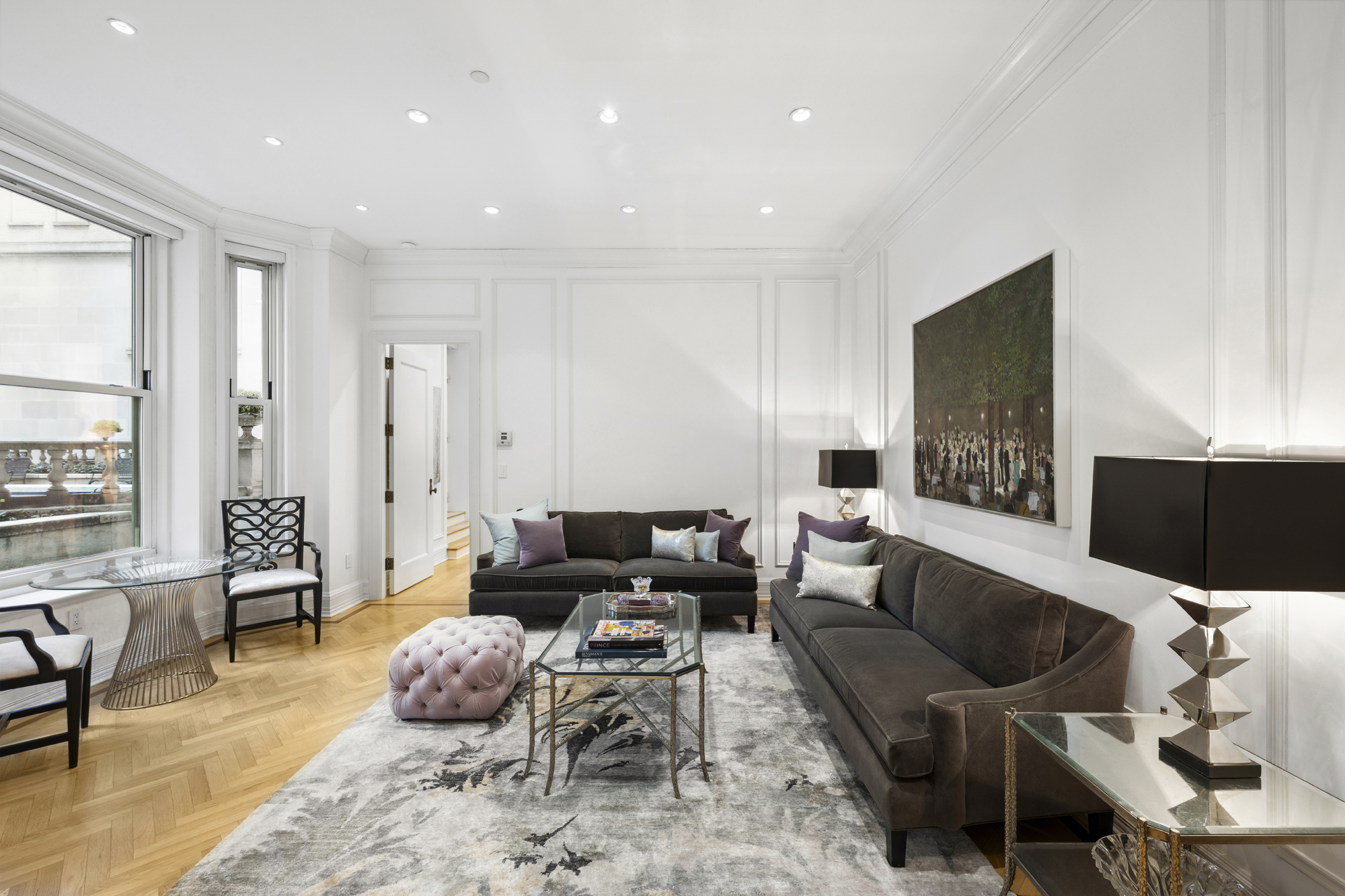 1 Central Park South, Unit 510 Manhattan, NY 10019 - Photo 2 of 23 a living room with furniture and a flat screen tv