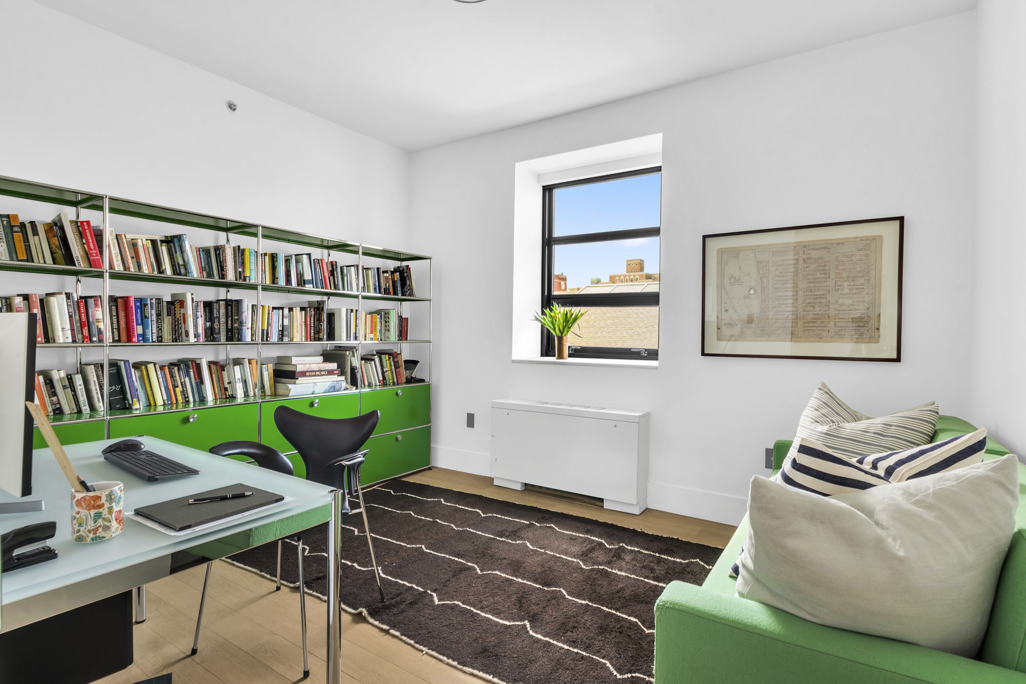 267 West 124th Street, Unit 6A Manhattan, NY 10027 - Photo 19 of 24 a living room with furniture and a book shelf