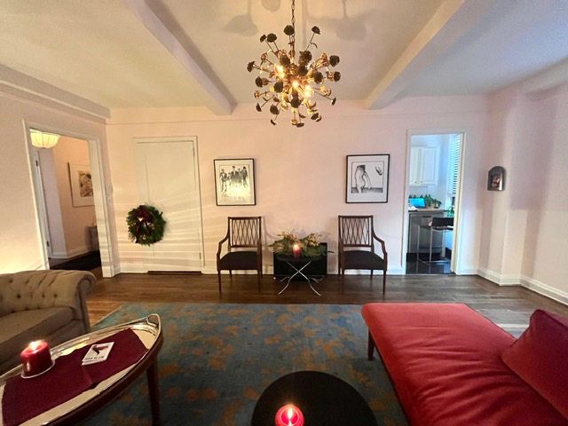 435 West 23rd Street, Unit 7B Manhattan, NY 10011 - Photo 3 of 23 a living room with furniture and a chandelier