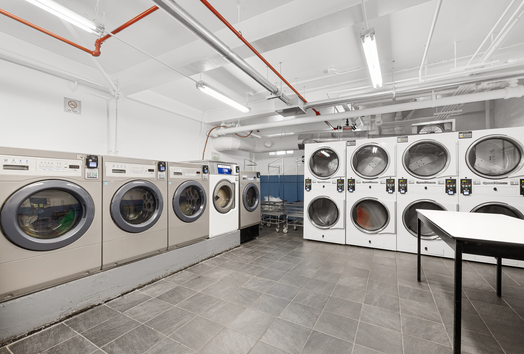 34-41 85th Street, Unit 4R Queens, NY 11372 - Photo 17 of 19 a utility room with dryer and washer
