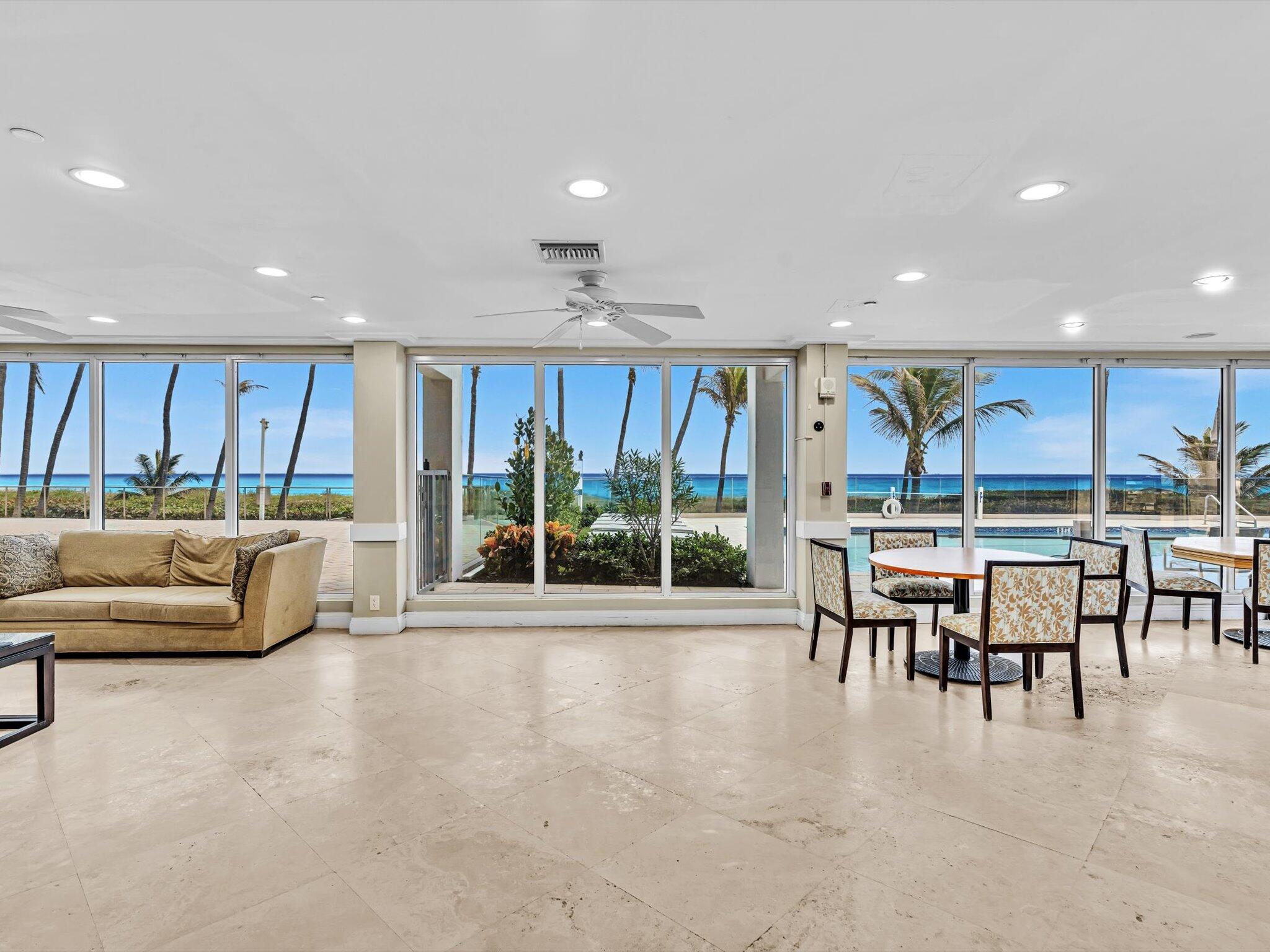 3000 South Ocean Boulevard, Unit 1504 Boca Raton, FL 33432 - Photo 42 of 64 a living room with furniture a table and kitchen view