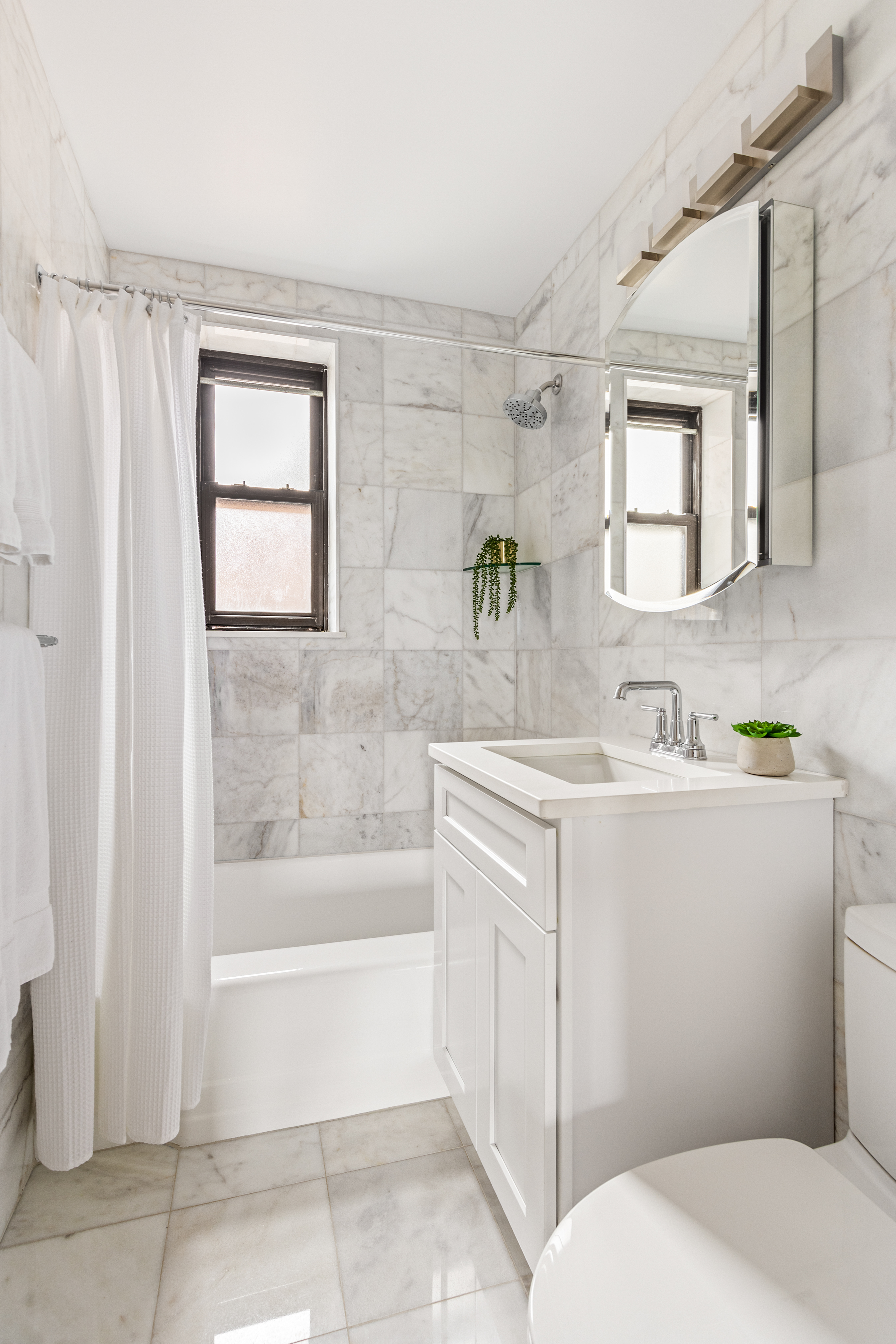 160 Ocean Parkway, Unit 6C Brooklyn, NY 11218 - Photo 8 of 9 a bathroom with a sink toilet and shower