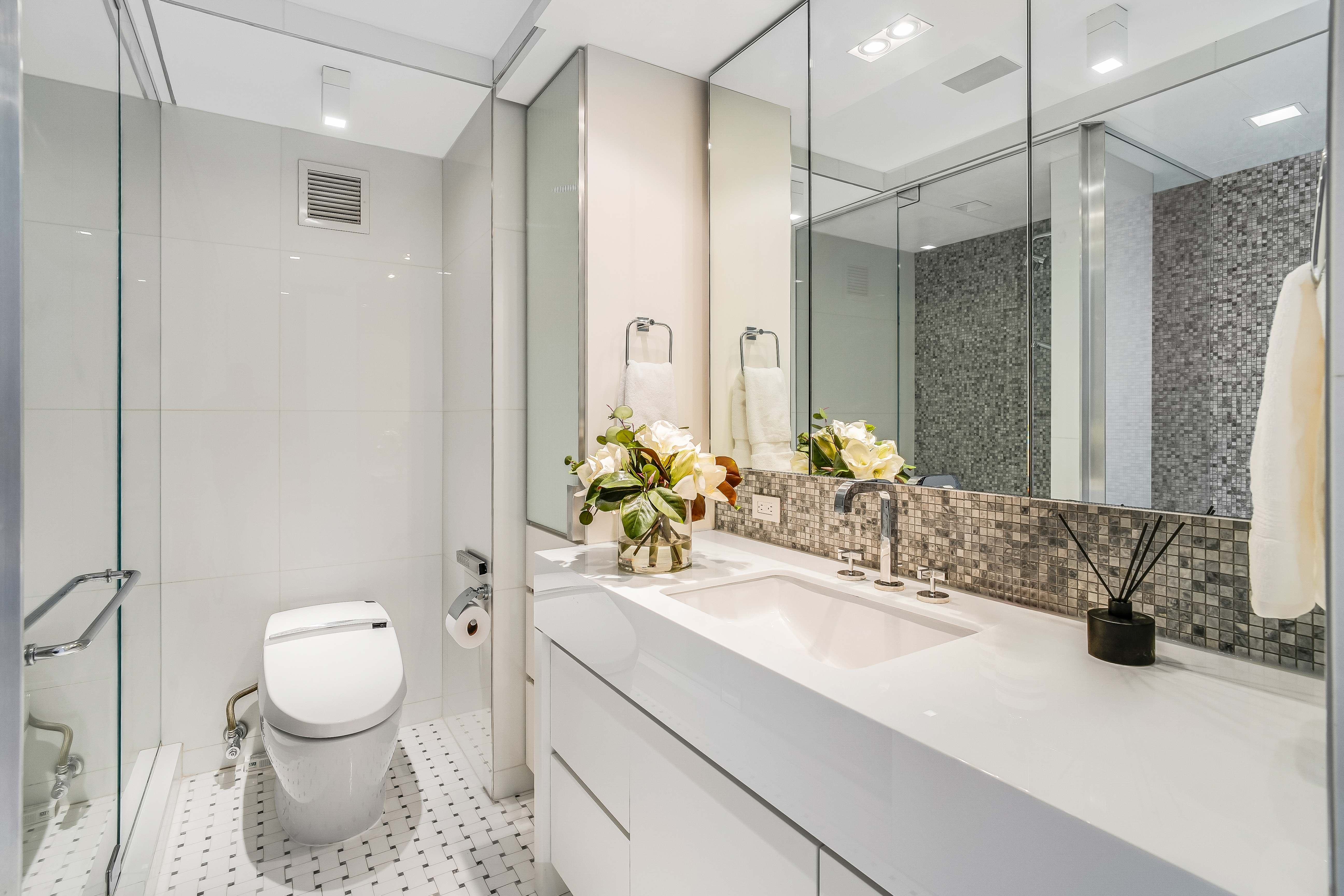1 5th Avenue, Unit 5GH Manhattan, NY 10003 - Photo 16 of 26 a bathroom with a sink toilet and shower
