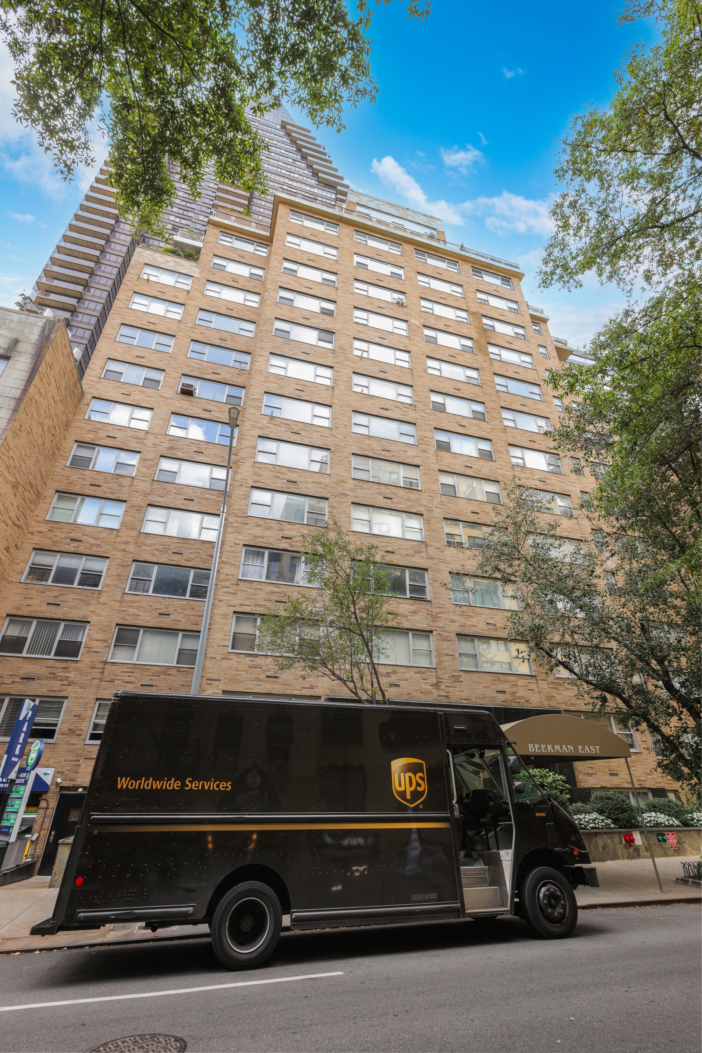 330 East 49th Street, Unit 9A Manhattan, NY 10017 - Photo 7 of 7 a car parked on the side of a building