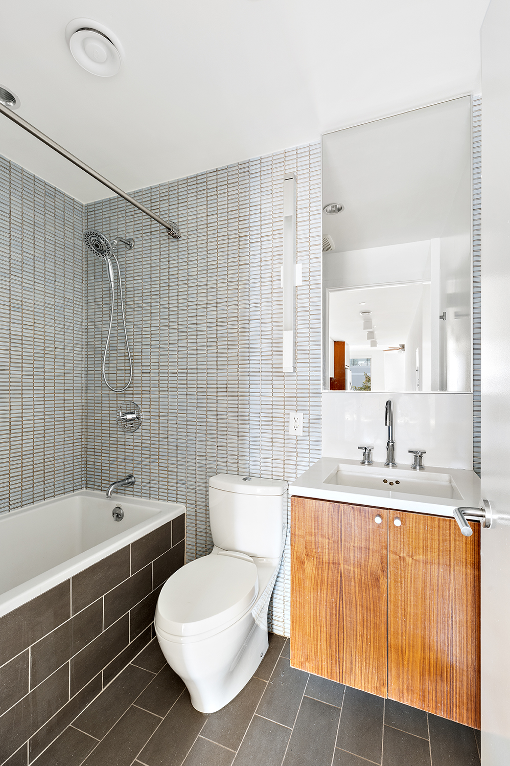 406 Bond Street, Unit 4 Brooklyn, NY 11231 - Photo 4 of 8 a bathroom with a double vanity sink toilet and shower
