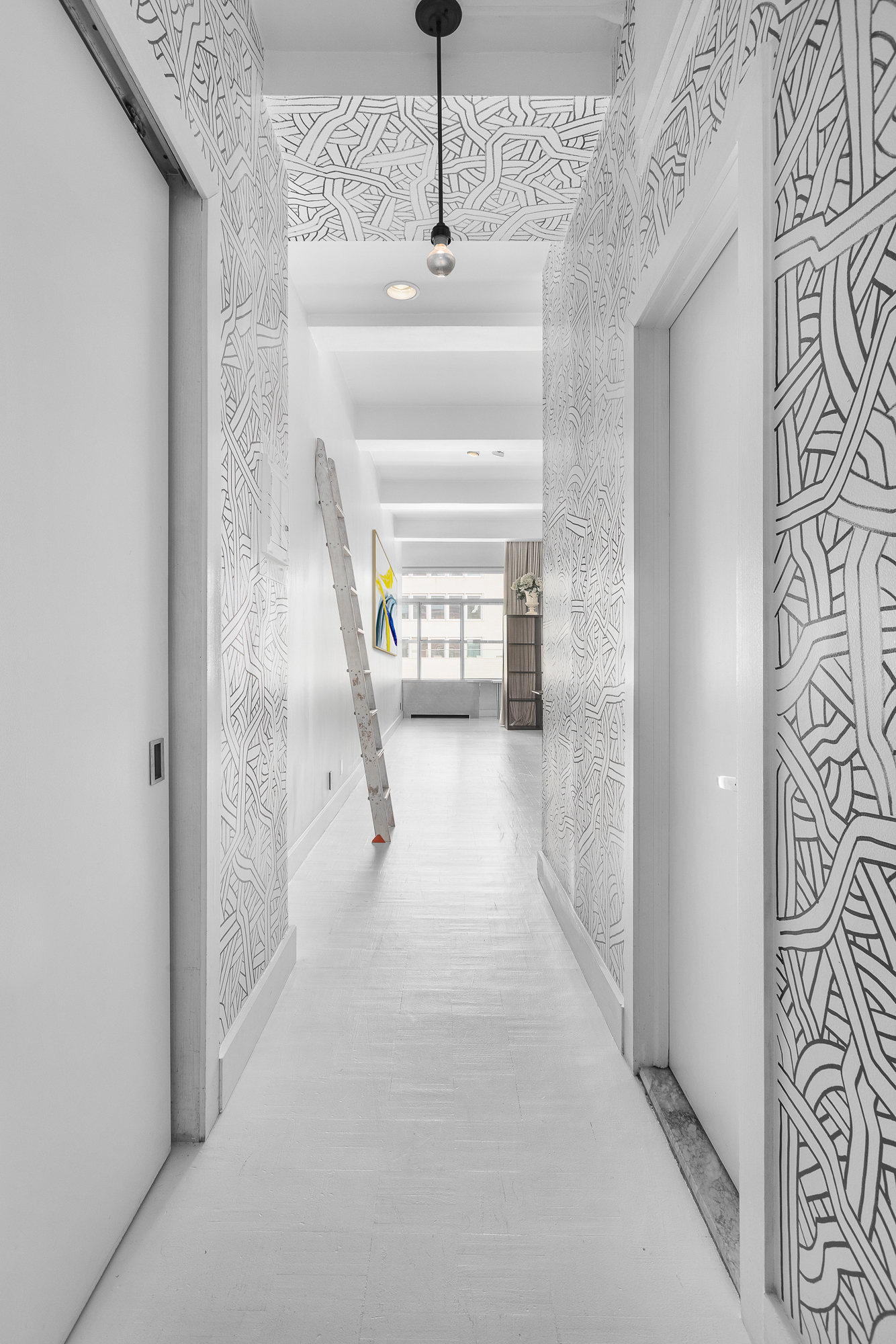244 Madison Avenue, Unit PHE Manhattan, NY 10016 - Photo 10 of 20 a hallway with a white walls next to a window