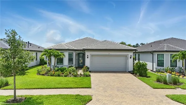 front view of a house with a yard