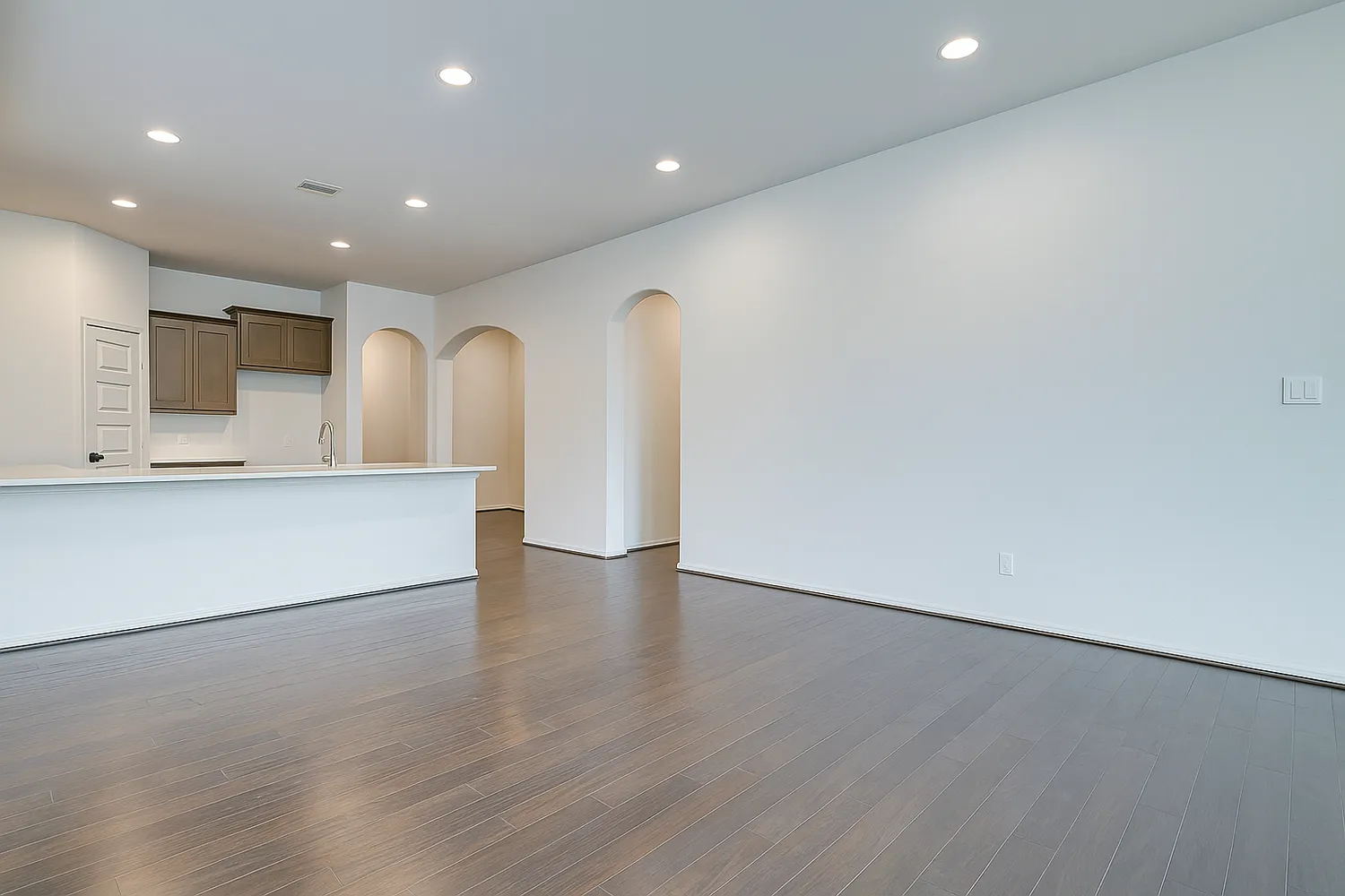 a view of a kitchen with a sink and a large window