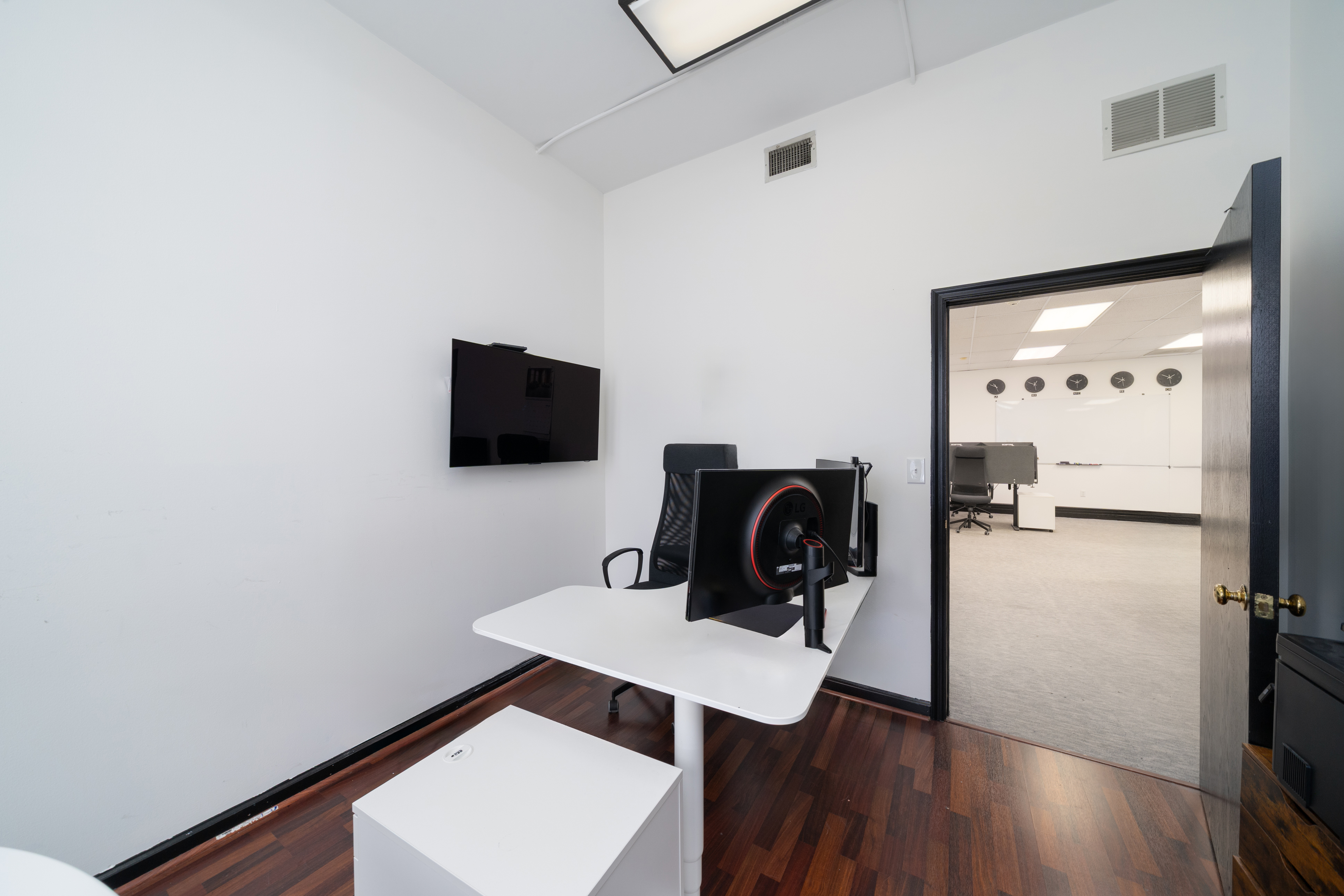 84 Washington Street Hoboken, NJ 07030 - Photo 3 of 11 a view of a workspace with furniture and wooden floor