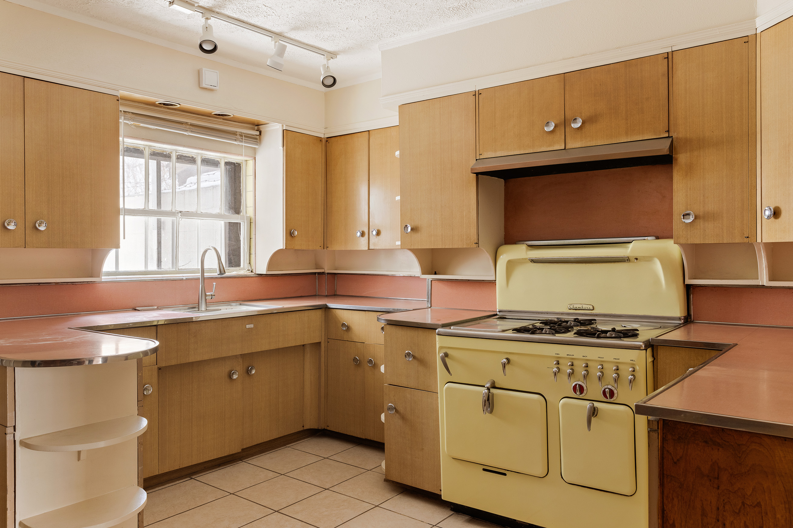 116 Brooklyn Avenue Brooklyn, NY 11216 - Photo 7 of 21 a kitchen with cabinets appliances a sink and a window