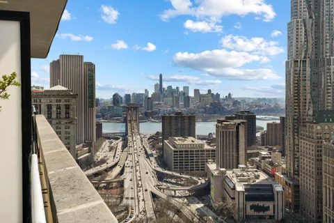 a view of a balcony with wooden floor