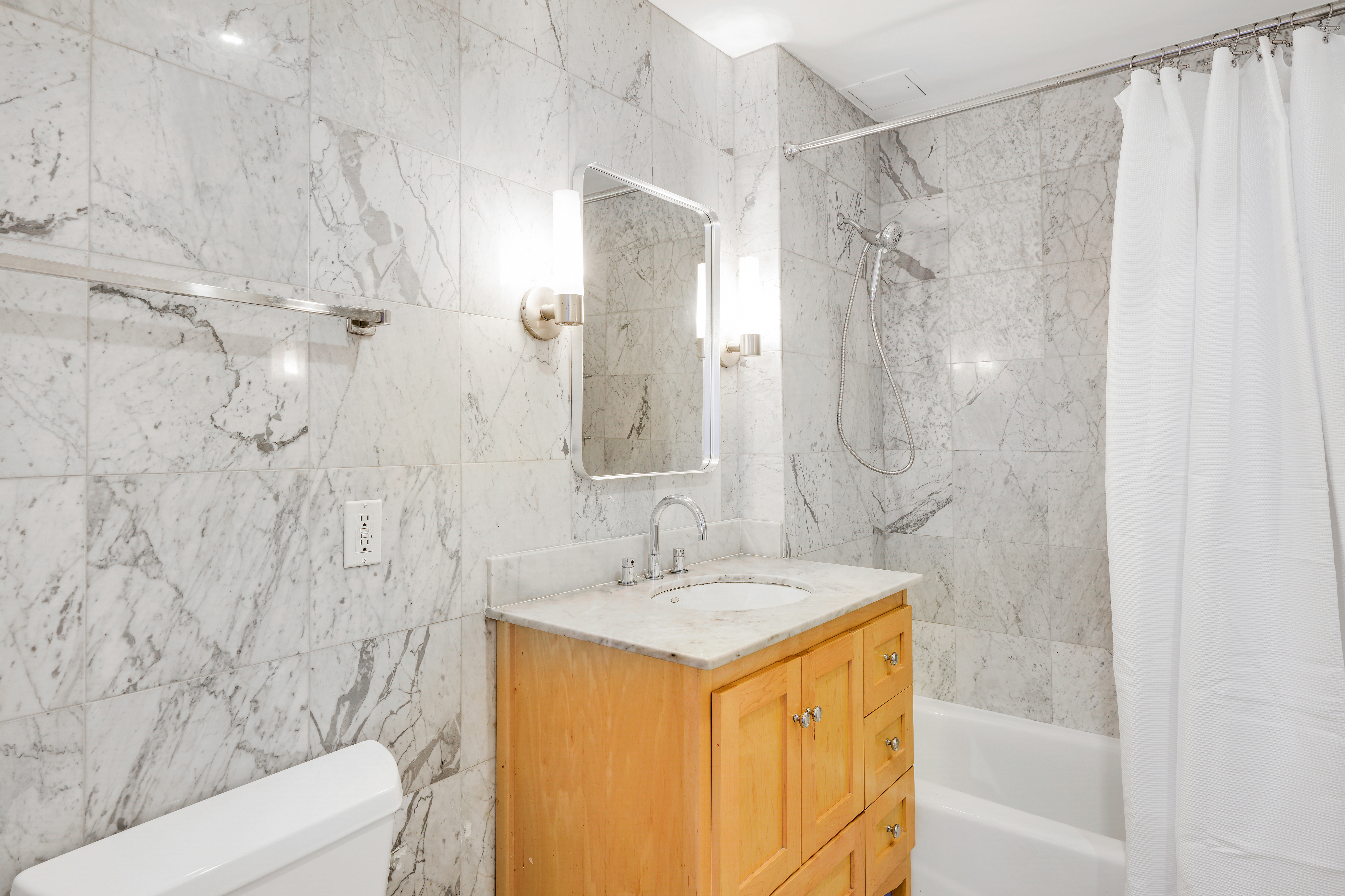 258 St Nicholas Avenue, Unit 3F Manhattan, NY 10027 - Photo 8 of 15 a bathroom with a sink and a mirror