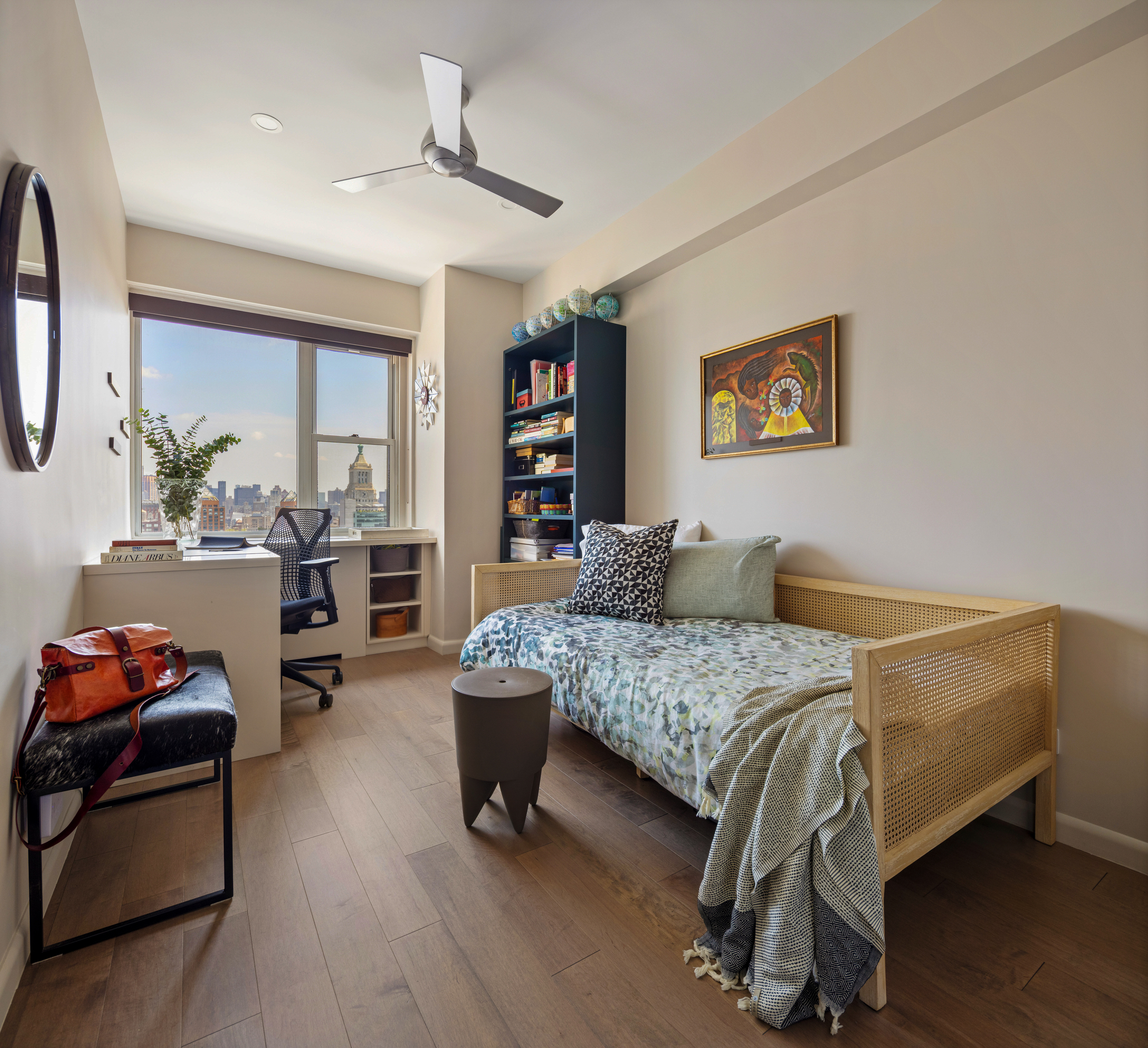 60 East 8th Street, Unit 30F Manhattan, NY 10003 - Photo 7 of 11 a bedroom with a bed and a couch