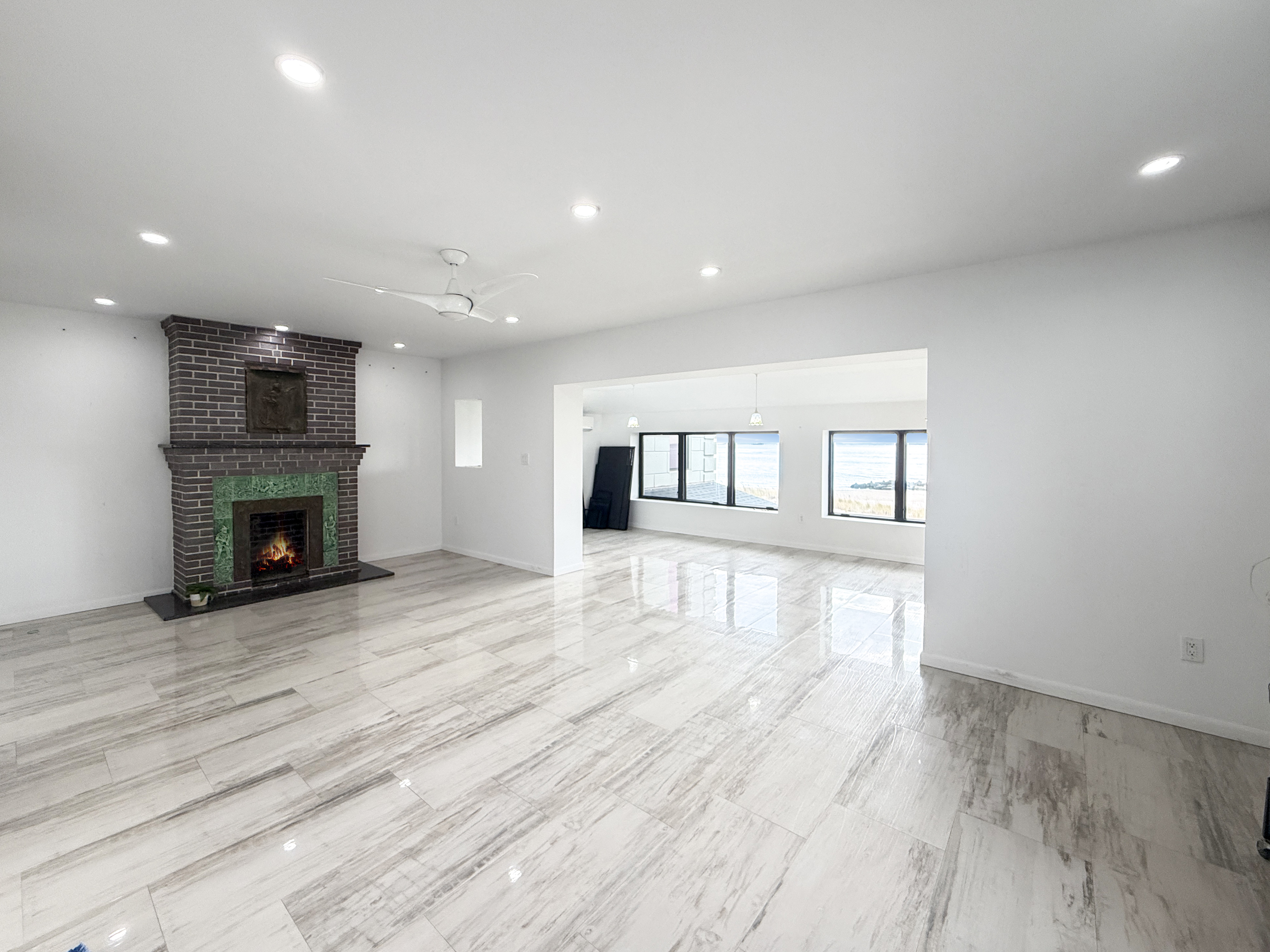 3848 Atlantic Avenue Brooklyn, NY 11224 - Photo 14 of 29 a view of empty room with wooden floor and fireplace
