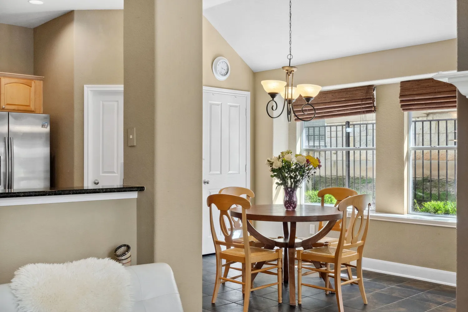 a dining room with furniture and window