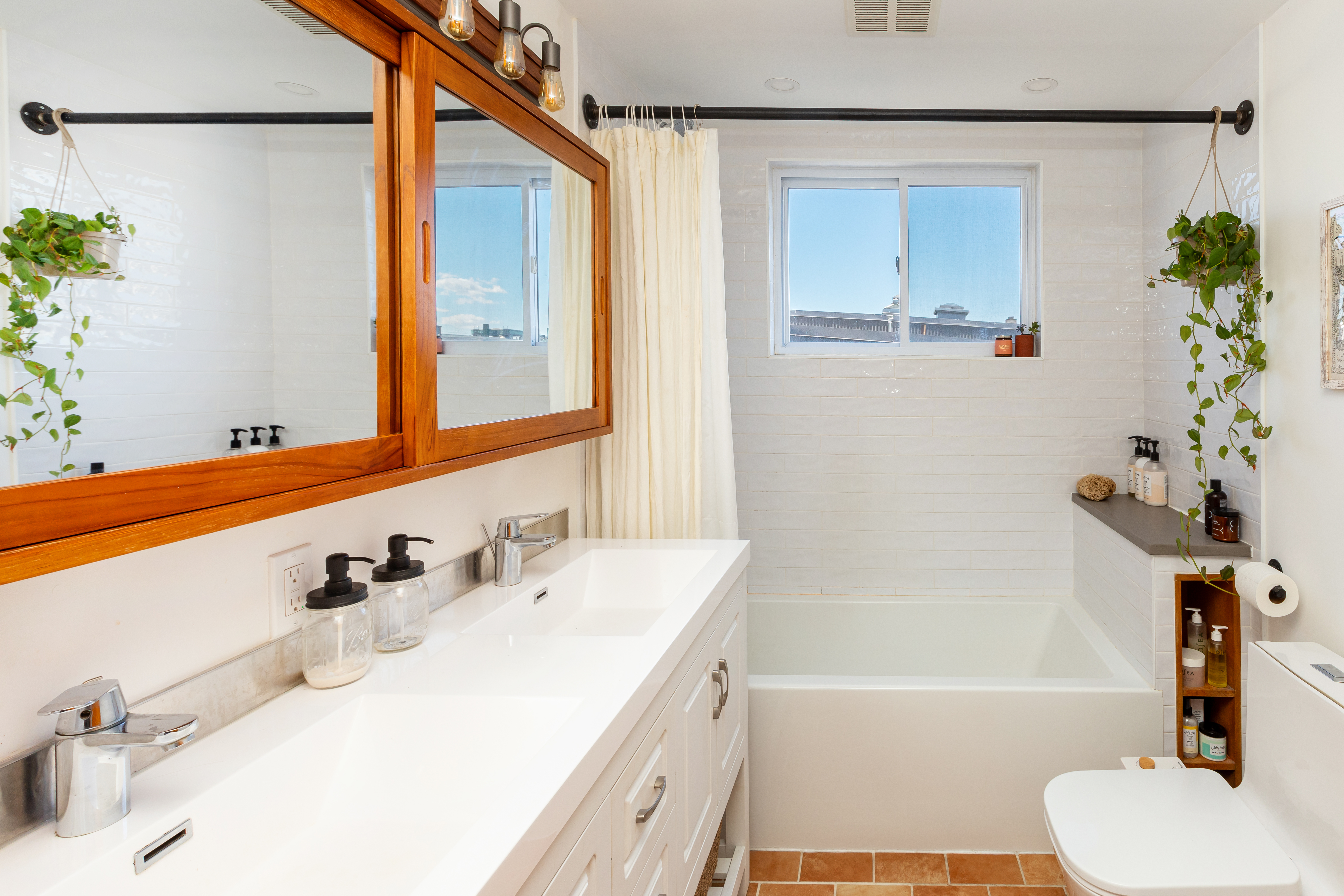 214 Eagle Street Brooklyn, NY 11222 - Photo 14 of 22 a bathroom with a sink and a mirror
