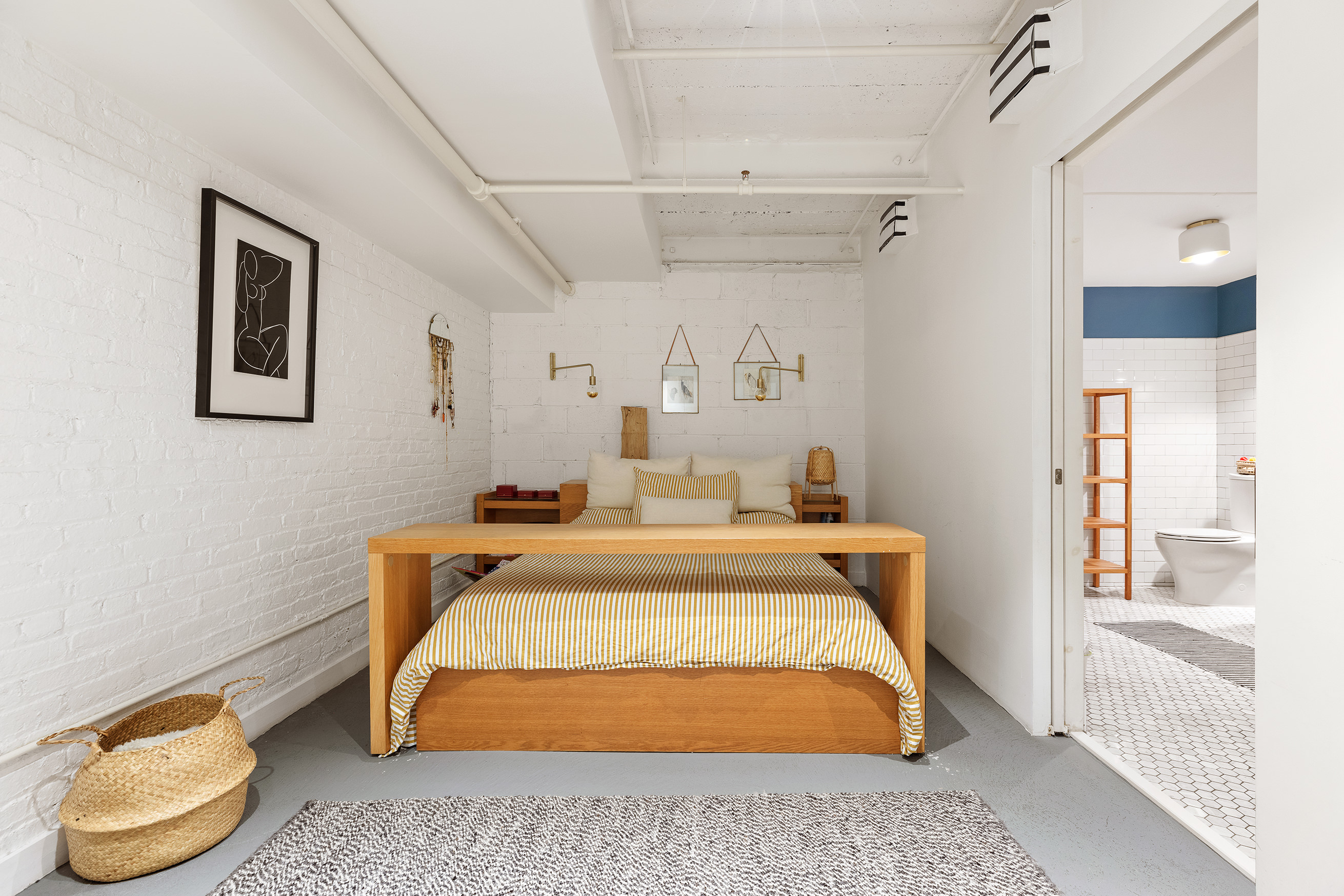 95 Lexington Avenue, Unit D1 Brooklyn, NY 11238 - Photo 6 of 13 a bedroom with a bed and a window