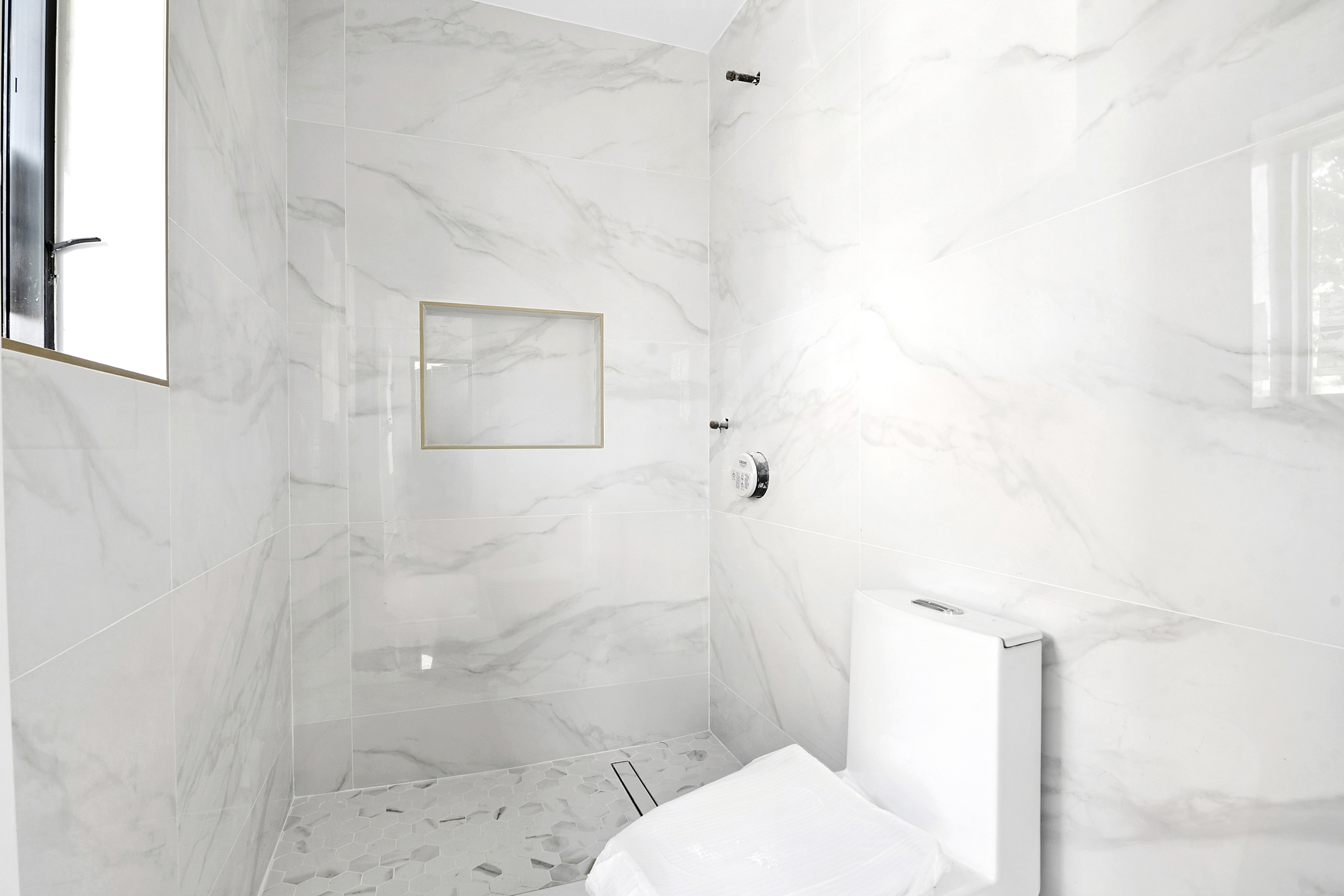 3624 Avenue P Brooklyn, NY 11234 - Photo 12 of 26 a bathroom with a toilet and shower