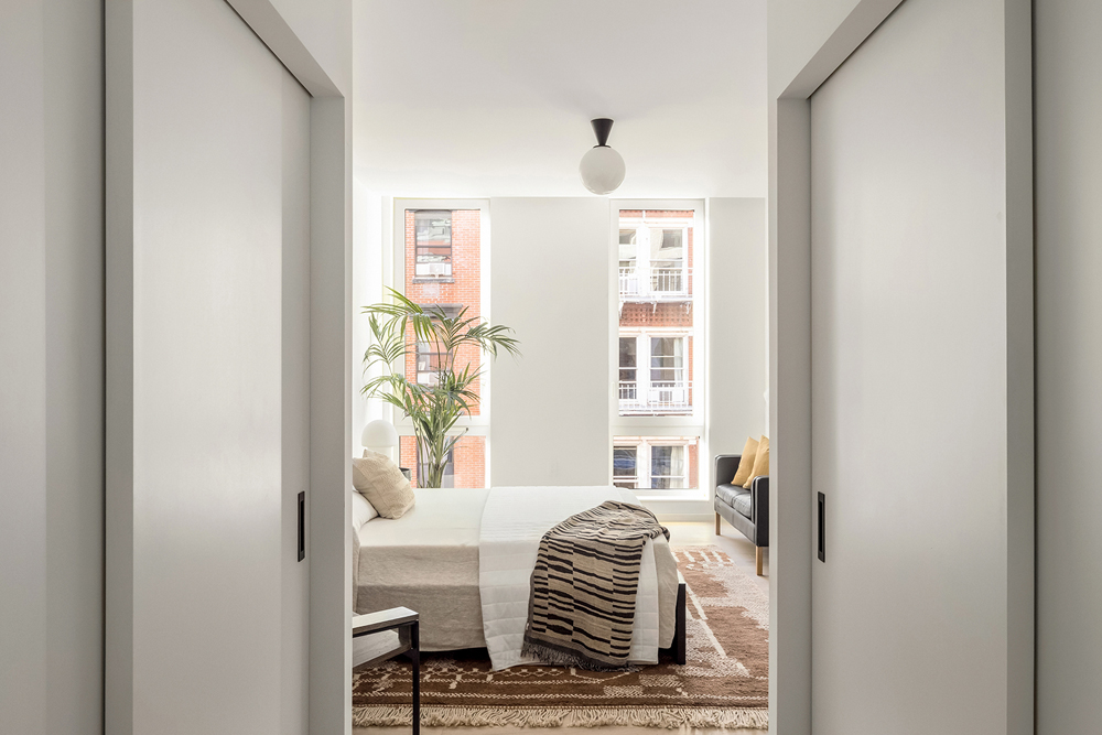 66 Clinton Street, Unit 6A Manhattan, NY 10002 - Photo 10 of 17 a bedroom with a bed and a window