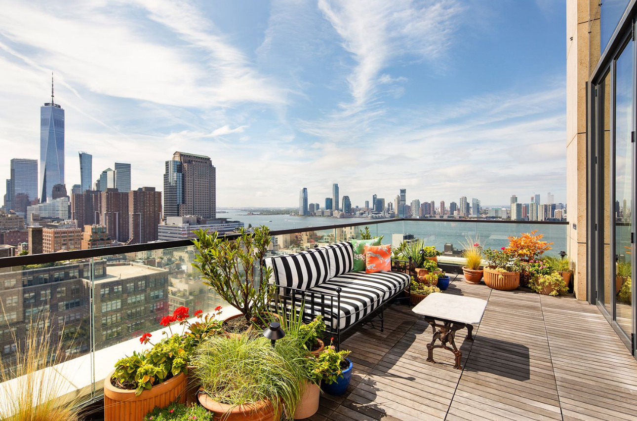 570 Broome Street, Unit PHA Manhattan, NY 10013 - Photo 21 of 22 a roof deck with couches and potted plants