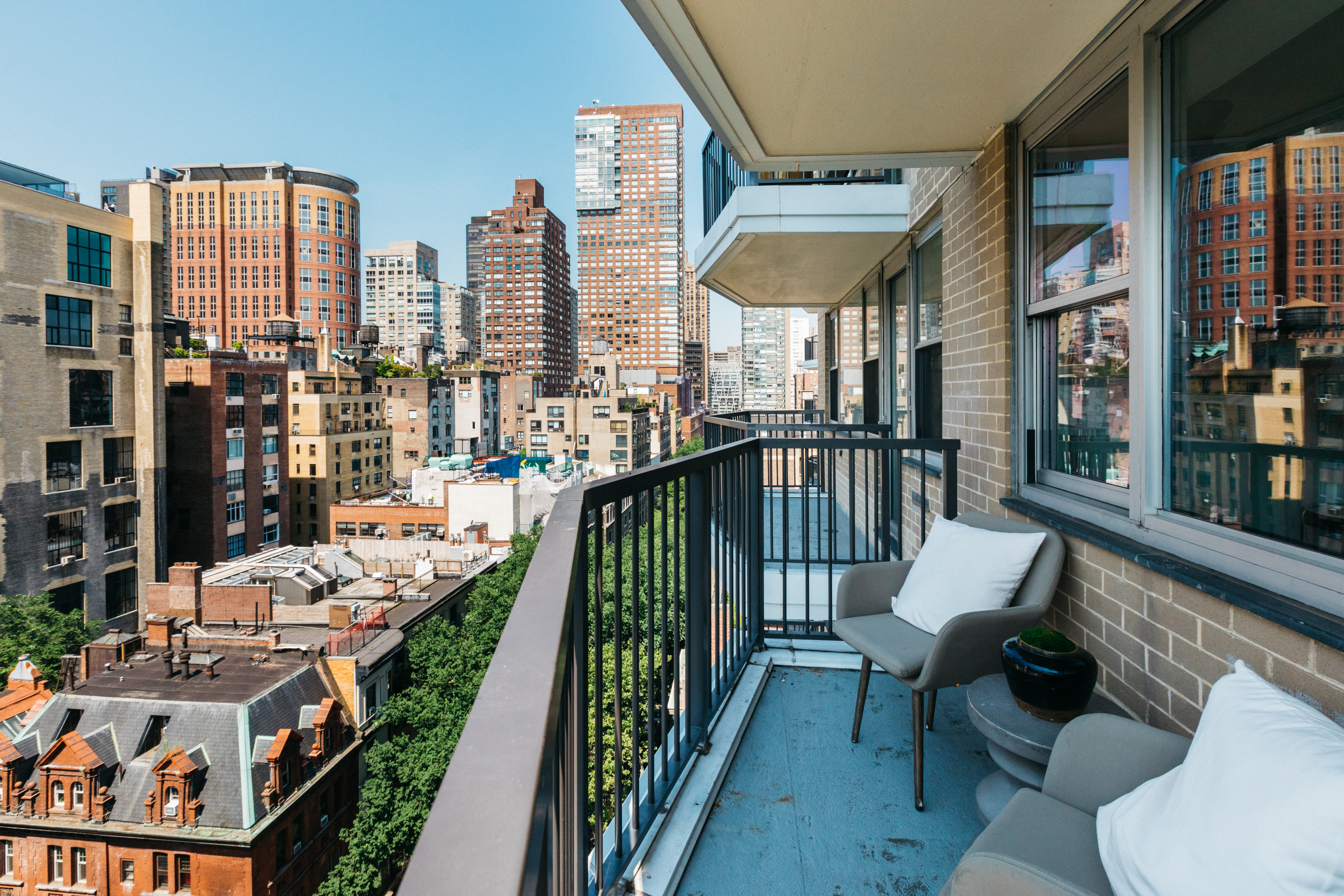 80 Central Park West, Unit 12C Manhattan, NY 10023 - Photo 14 of 27 a balcony with furniture and city view