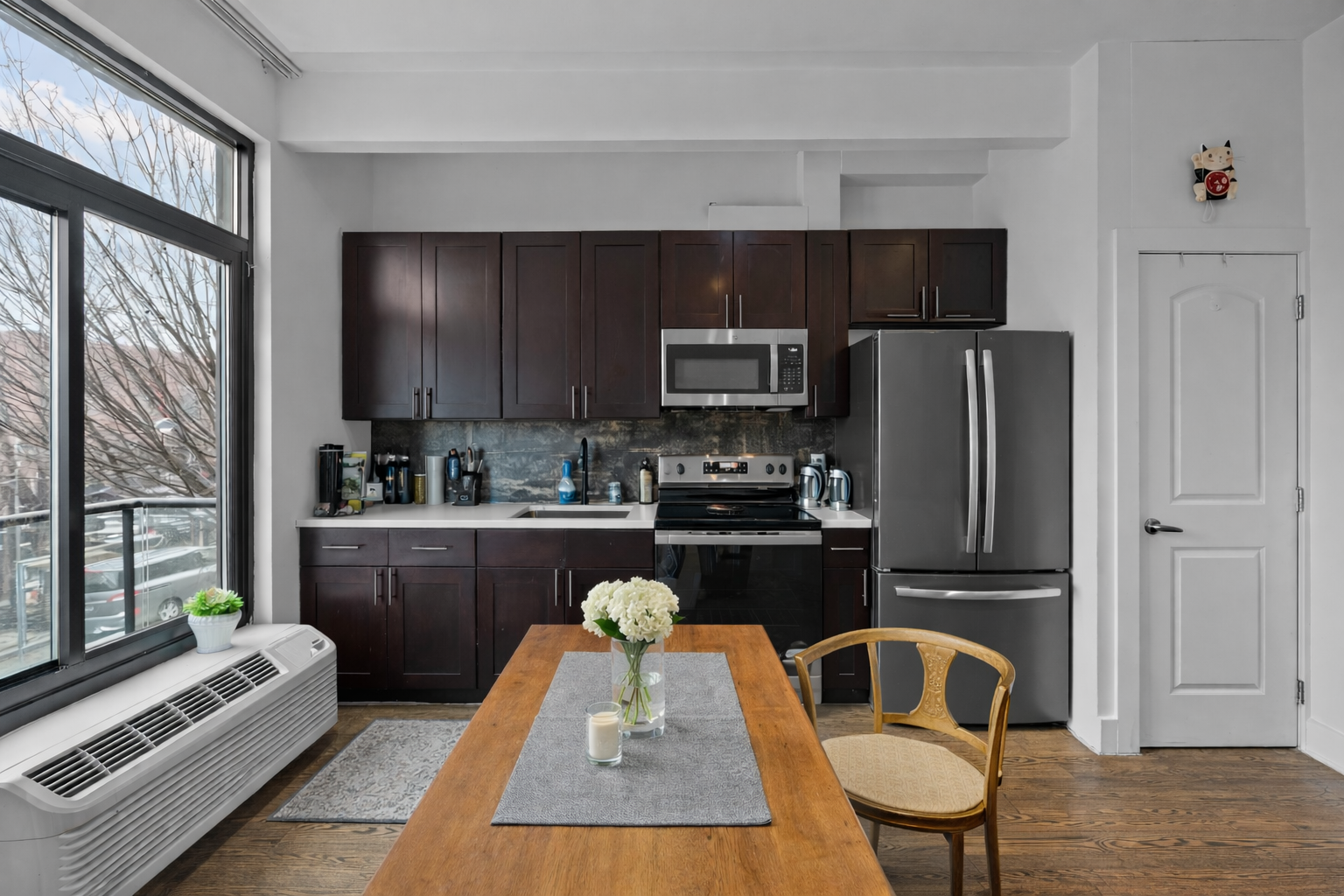 81 Suydam Street, Unit MULTI Brooklyn, NY 11221 - Photo 3 of 11 a kitchen with kitchen island granite countertop a refrigerator stove top oven and sink