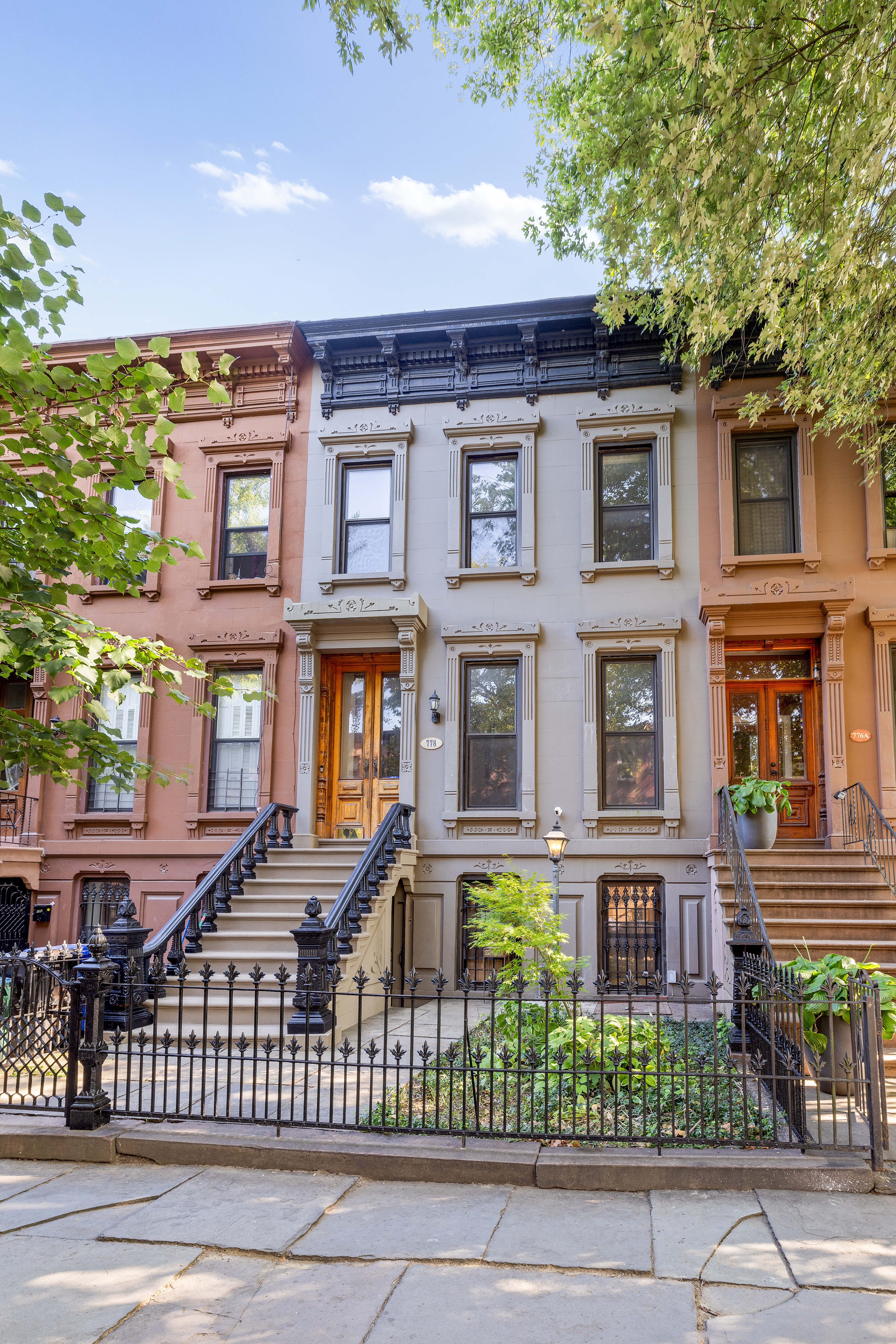 778 Quincy Street, Unit 2 Brooklyn, NY 11221 - Photo 13 of 14 a front view of a residential apartment building with a yard