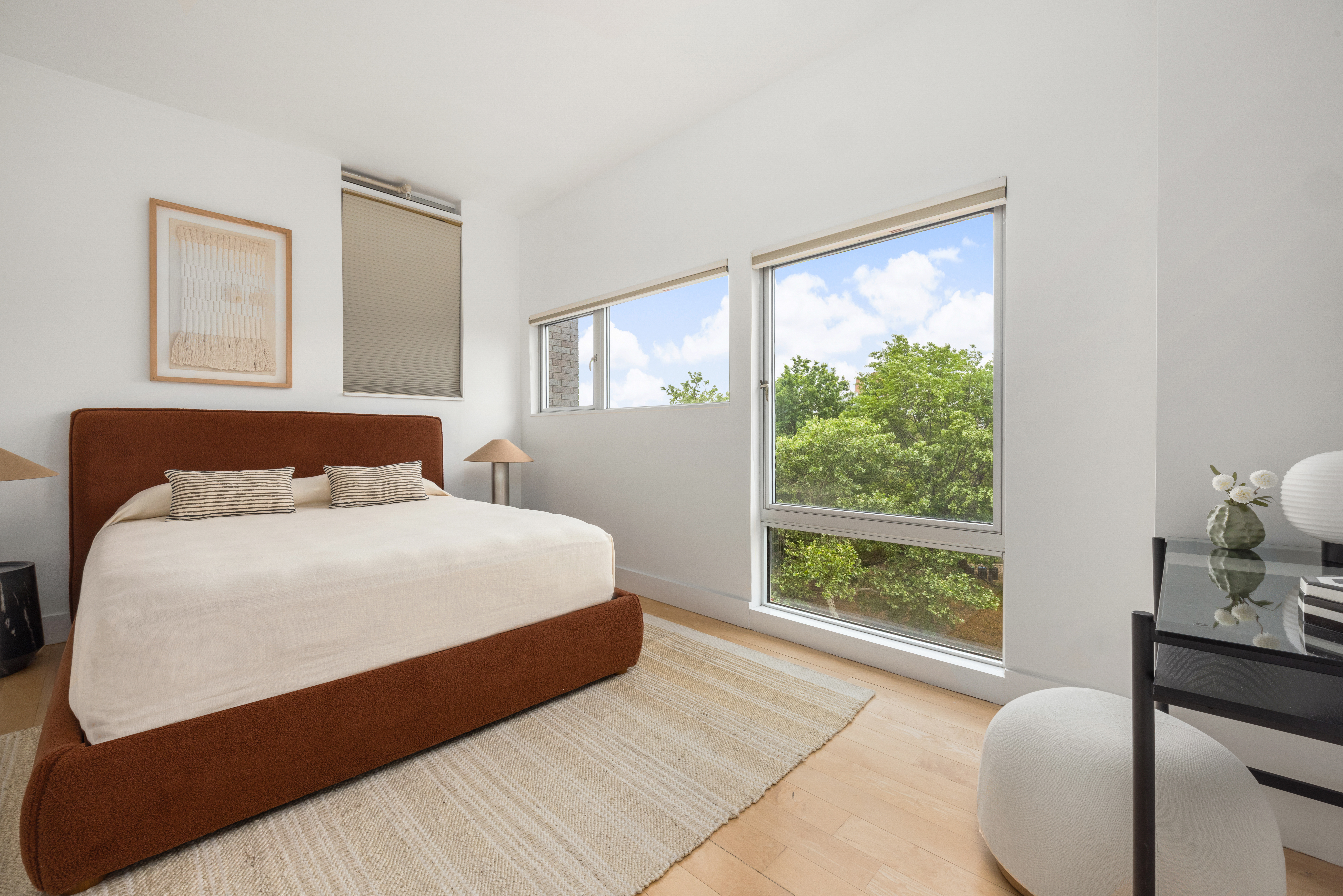 297 Driggs Avenue, Unit 4A Brooklyn, NY 11222 - Photo 6 of 9 a bedroom with a large bed and a window