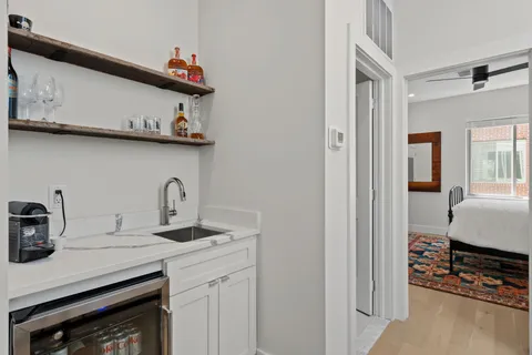 a living room with furniture a air conditioner and a window