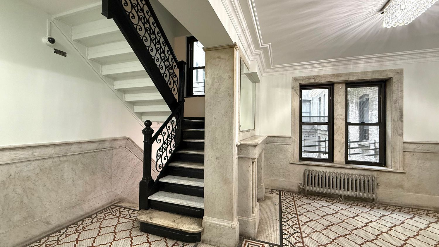 a view of an entryway with wooden floor and stairs