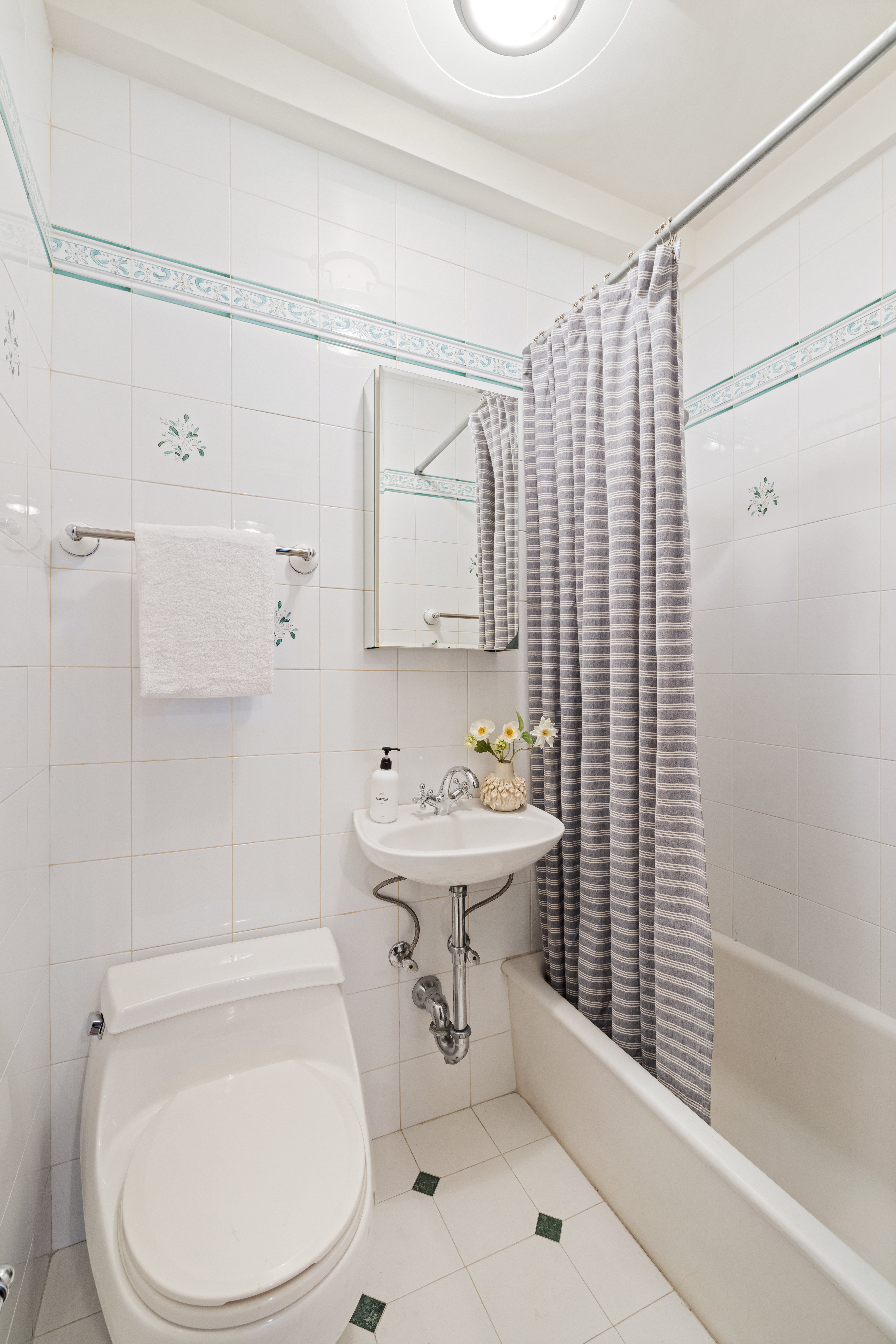320 East 72nd Street, Unit 5B Manhattan, NY 10021 - Photo 17 of 18 a bathroom with a sink toilet and shower