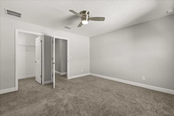 a bathroom with a double vanity sink a mirror and a bathtub