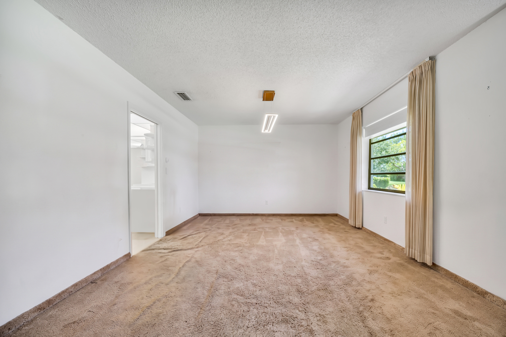 6760 Southwest 62nd Terrace Miami, FL 33143 - Photo 7 of 38 an empty room with windows
